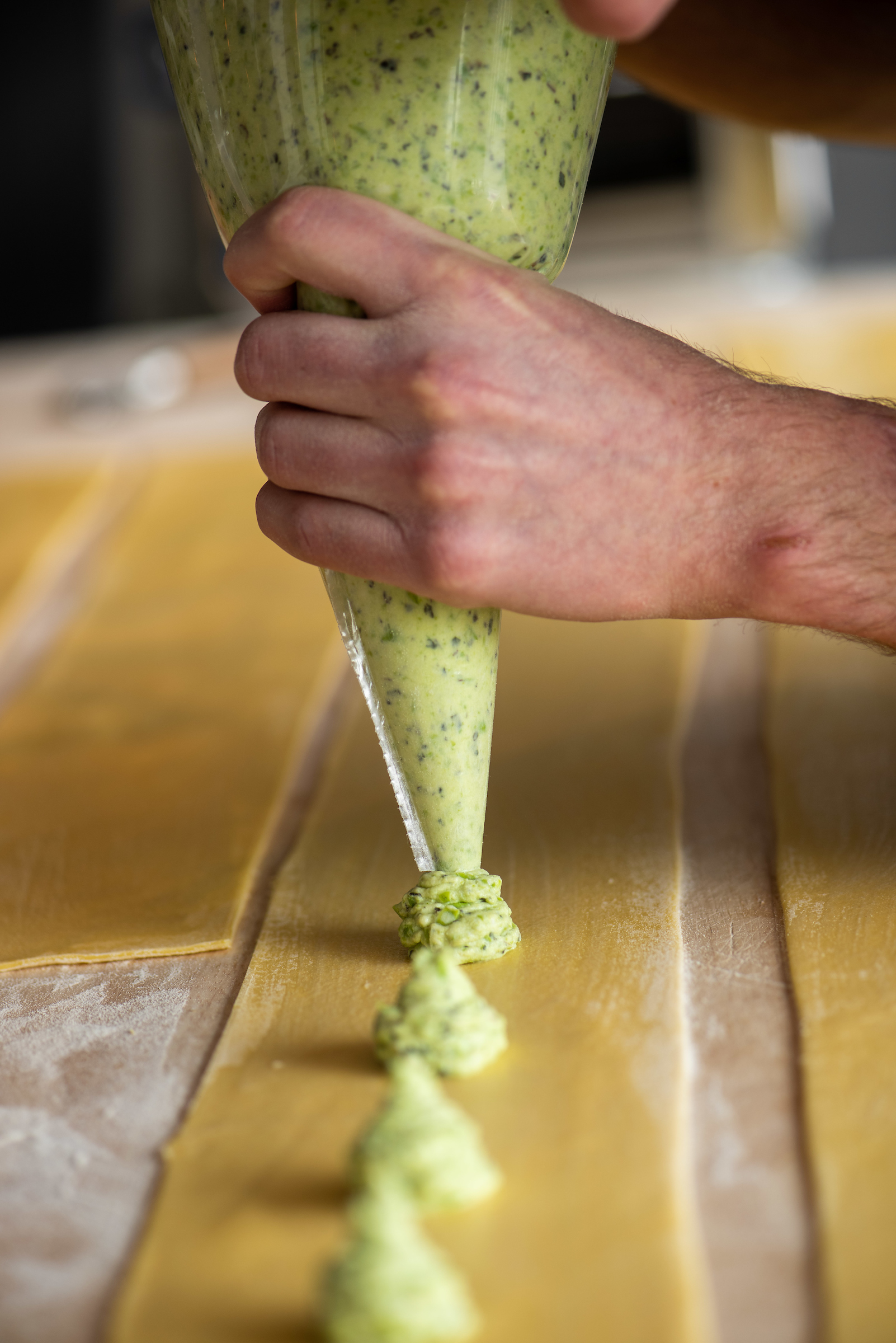 a hand holding a fork and knife