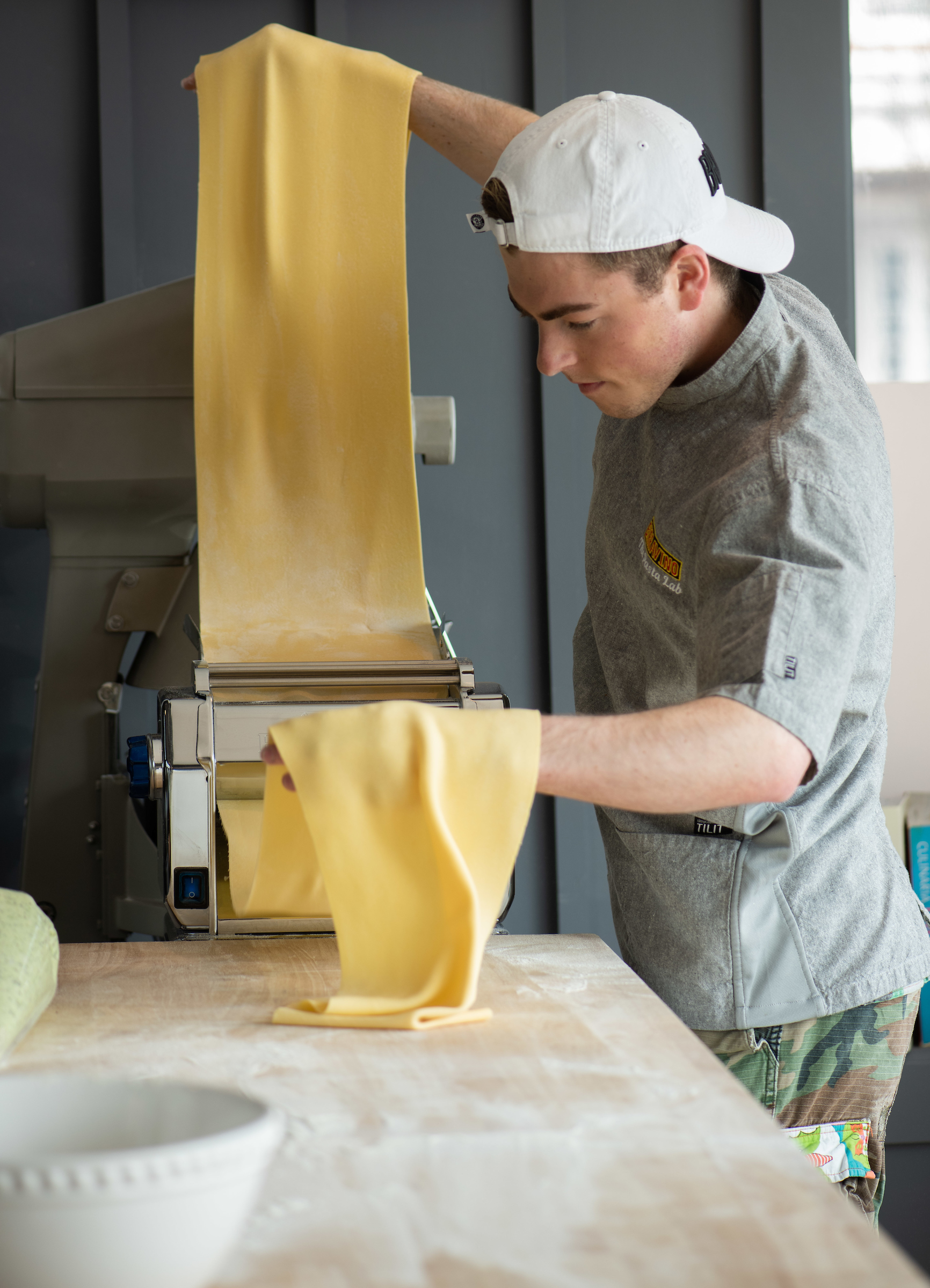 a boy is preparing food in a kitchen
