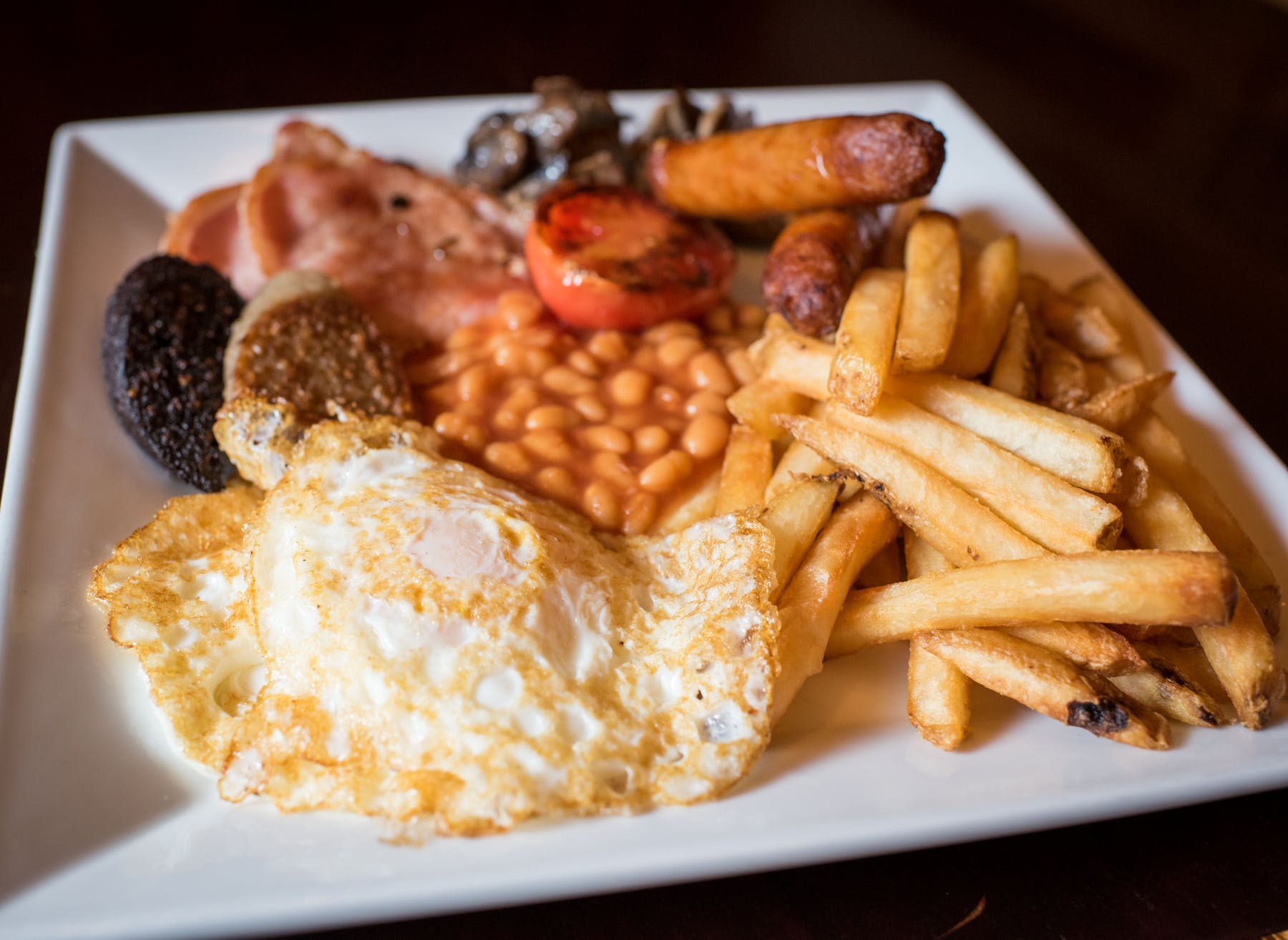 a plate of food that is on the side of fries