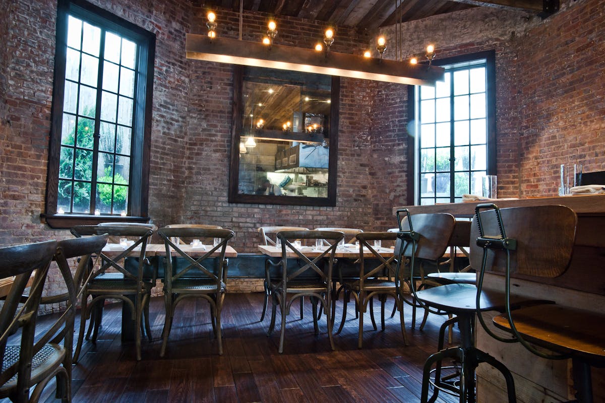 a dining room table in front of a window