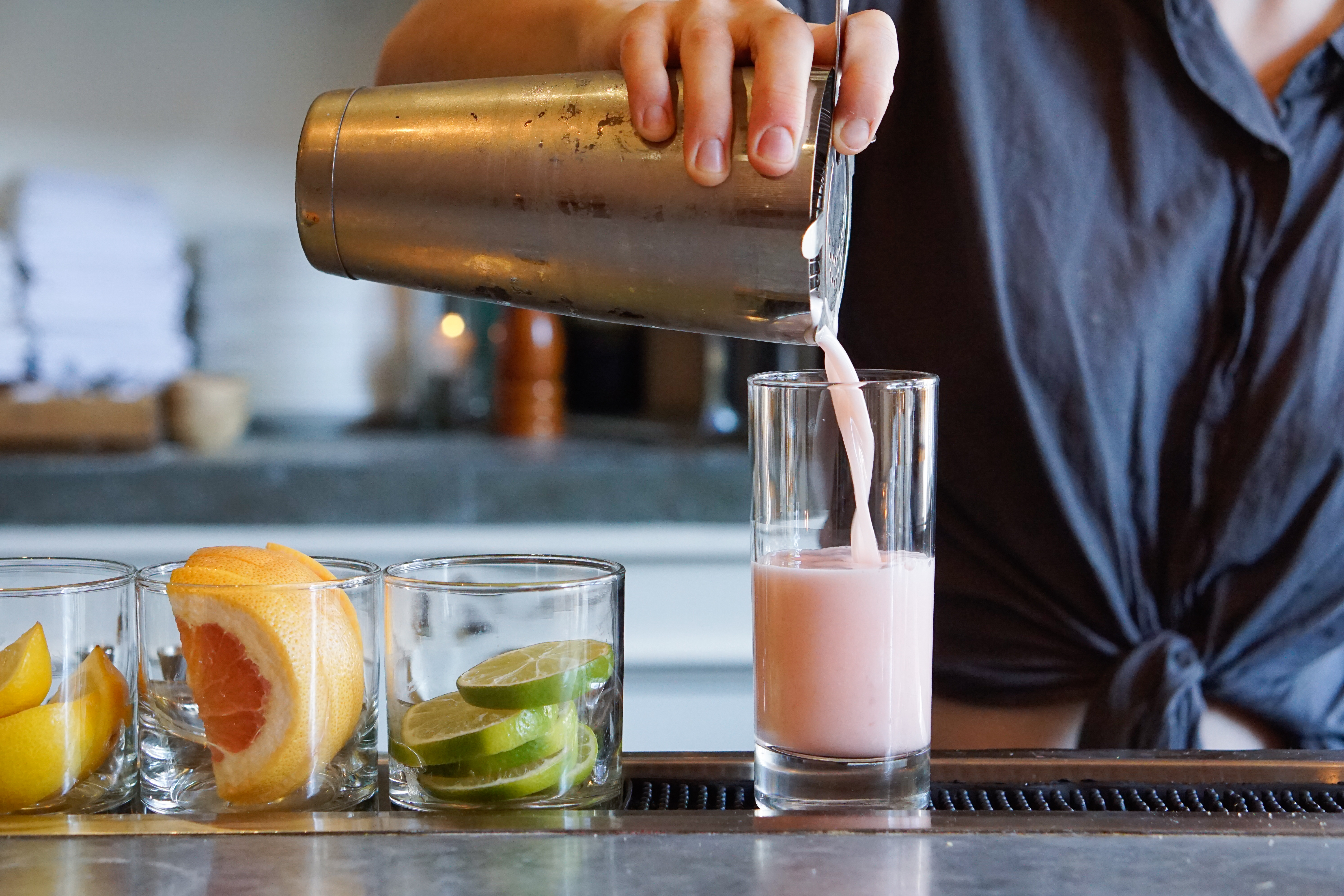 a person holding a glass of beer