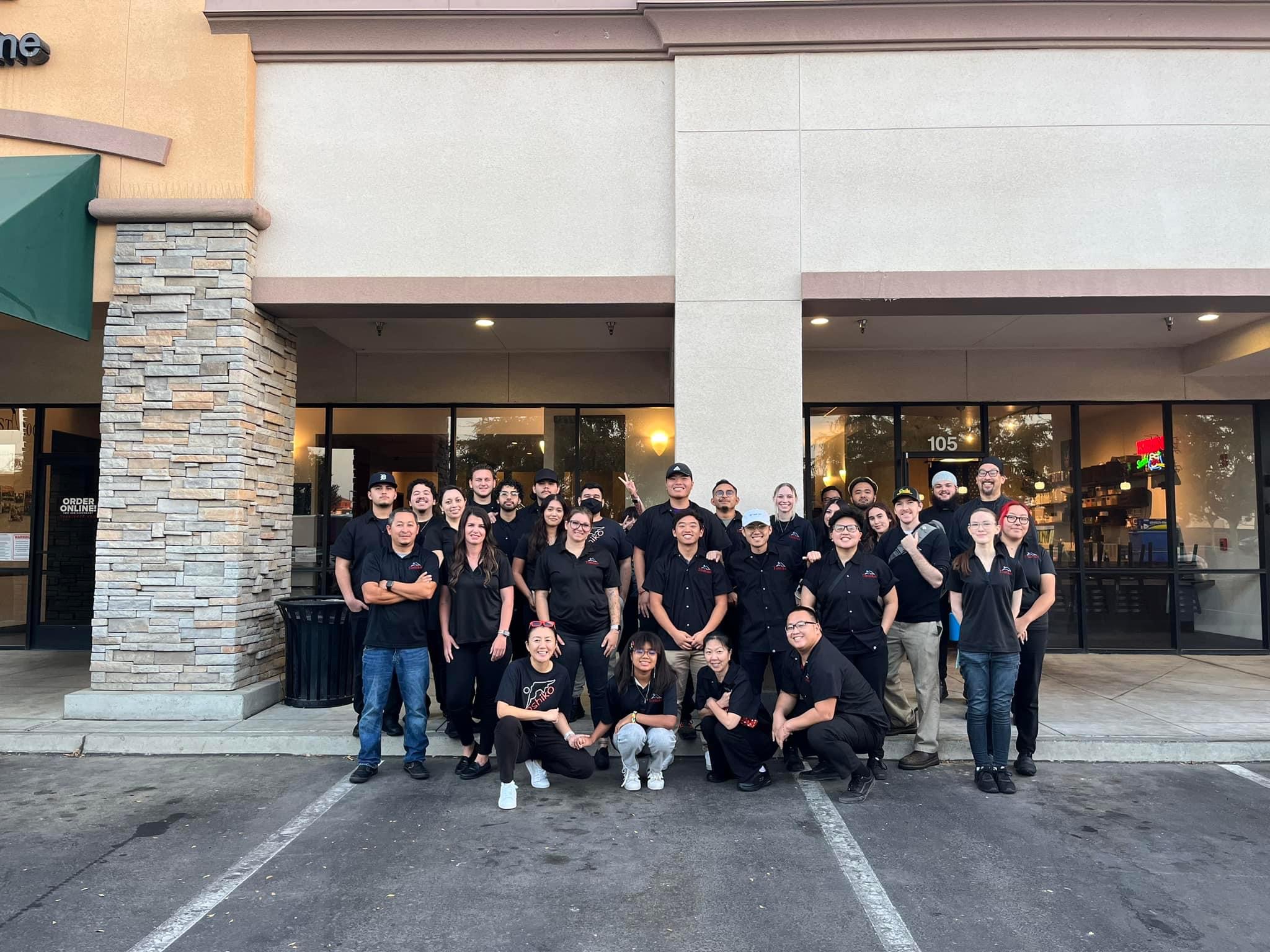 a group of people standing in front of a building