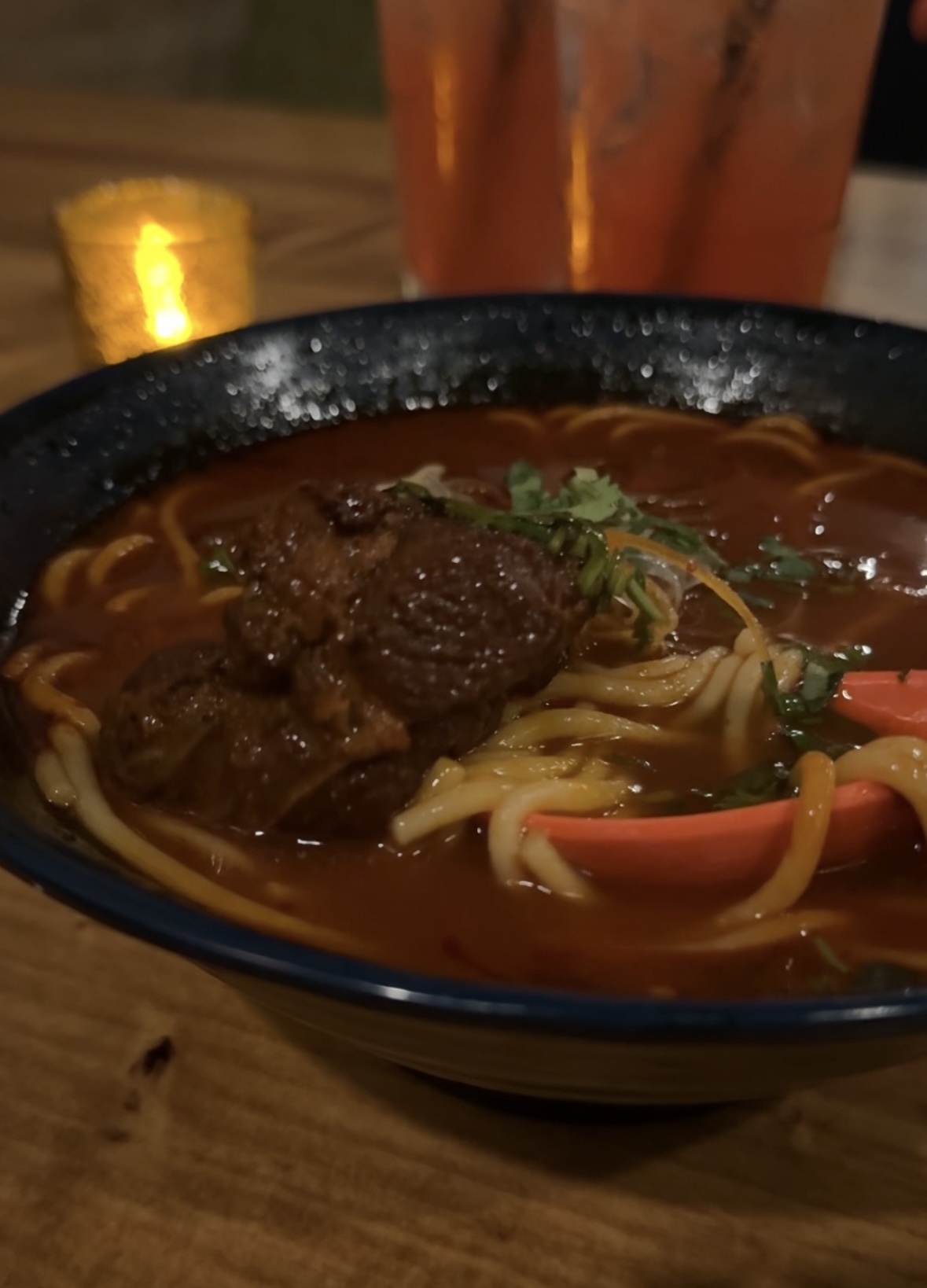 a bowl of soup with meat and vegetables