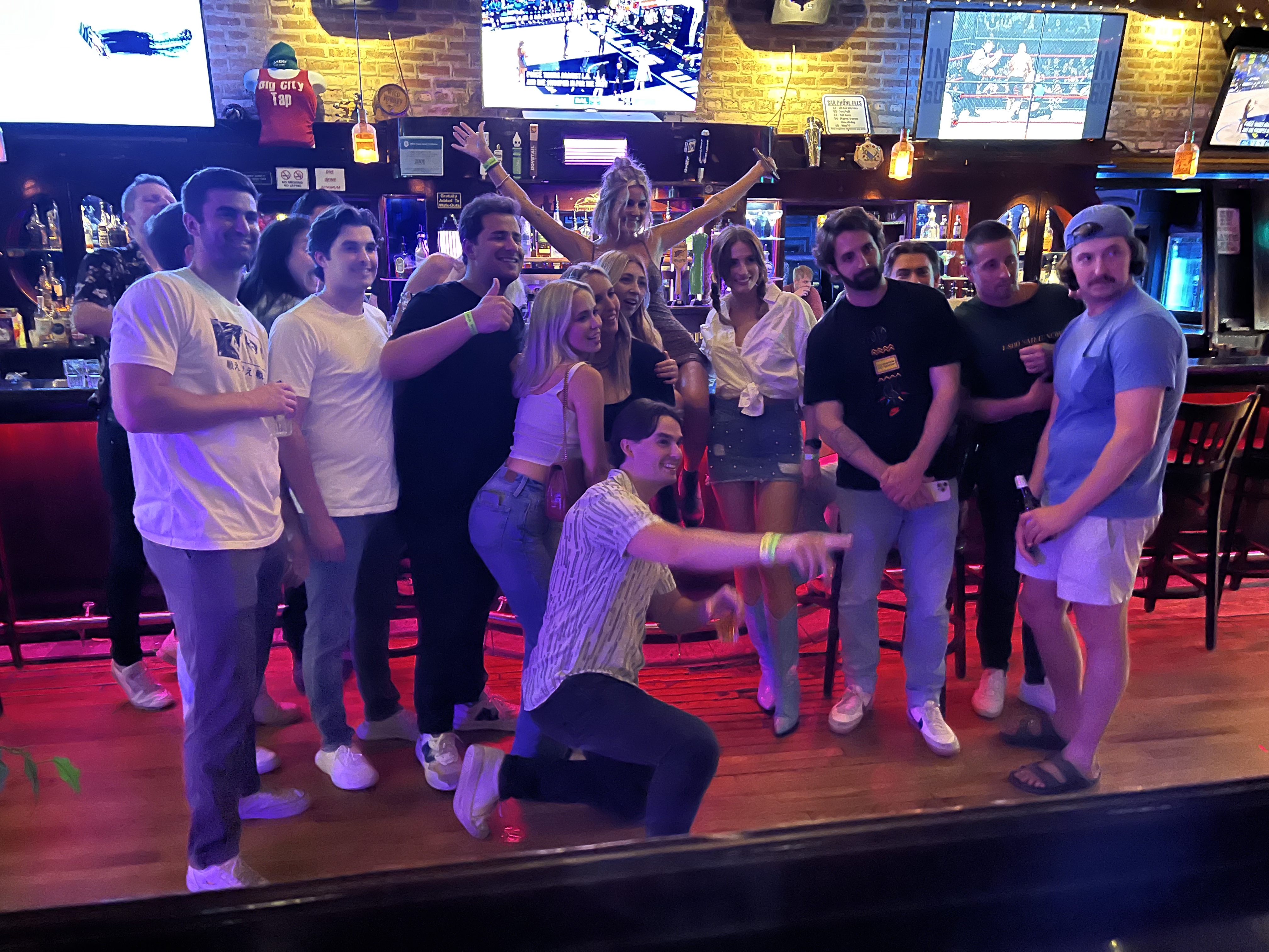 a group of people standing on a stage in front of a crowd