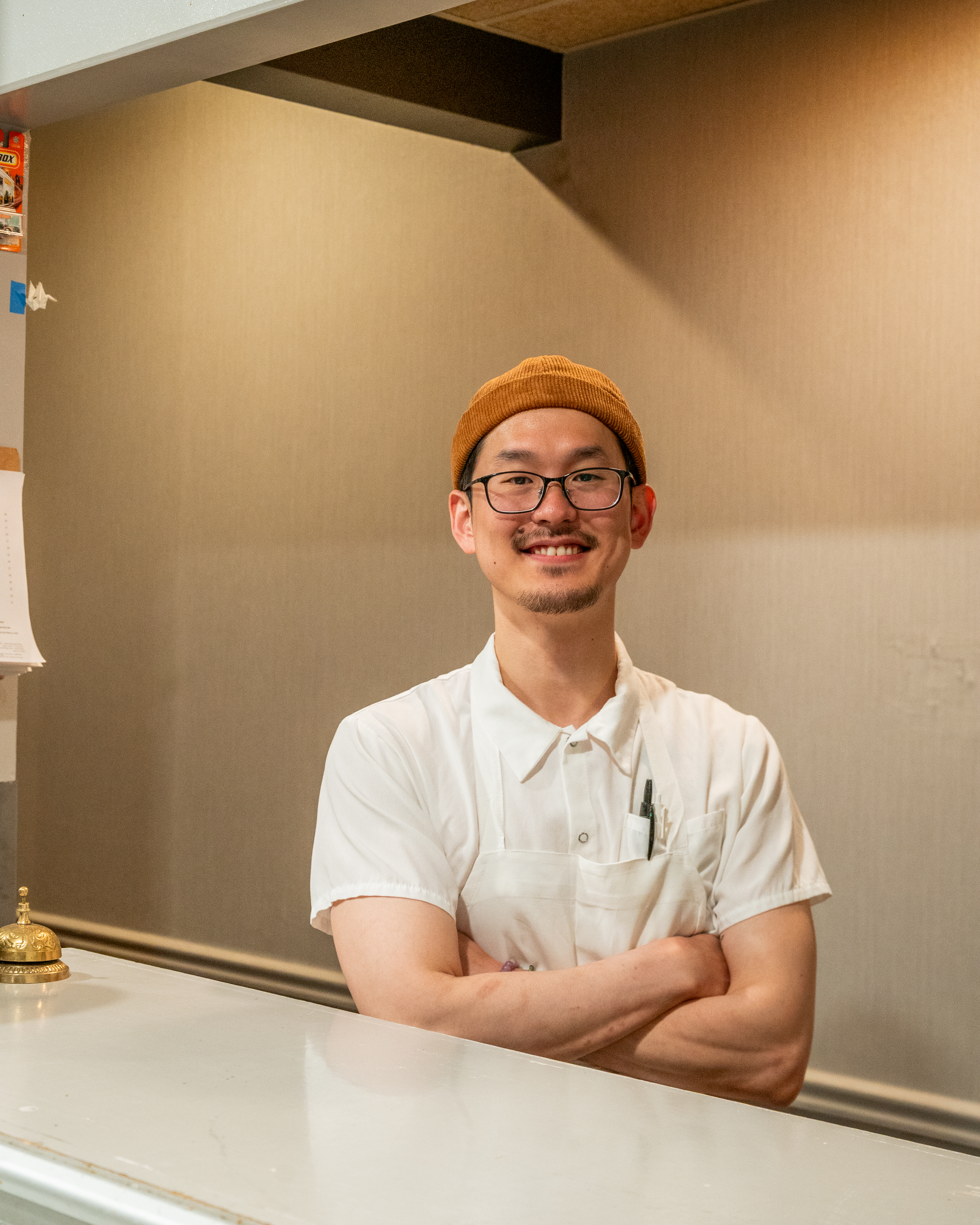 a man standing in front of a mirror posing for the camera