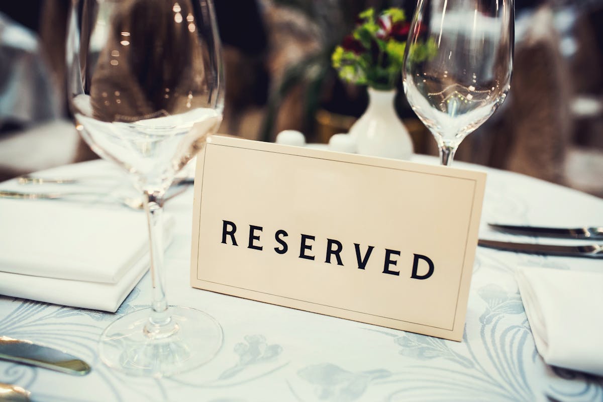 a close up of a wine glass on a table