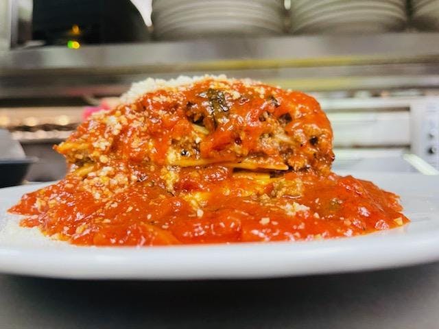 a pizza sitting on top of a plate of food