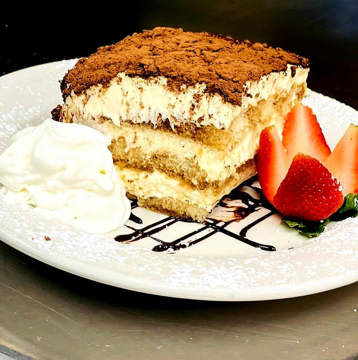 a piece of cake and ice cream on a plate