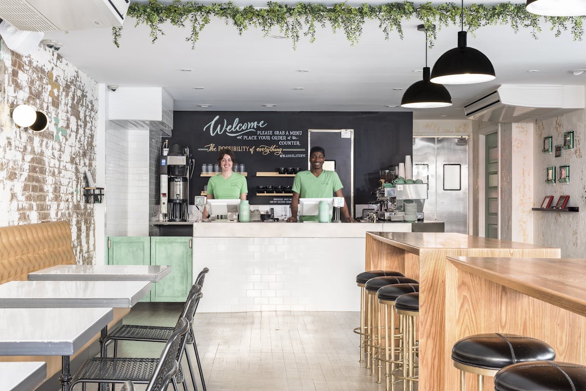 a kitchen with a table in a restaurant