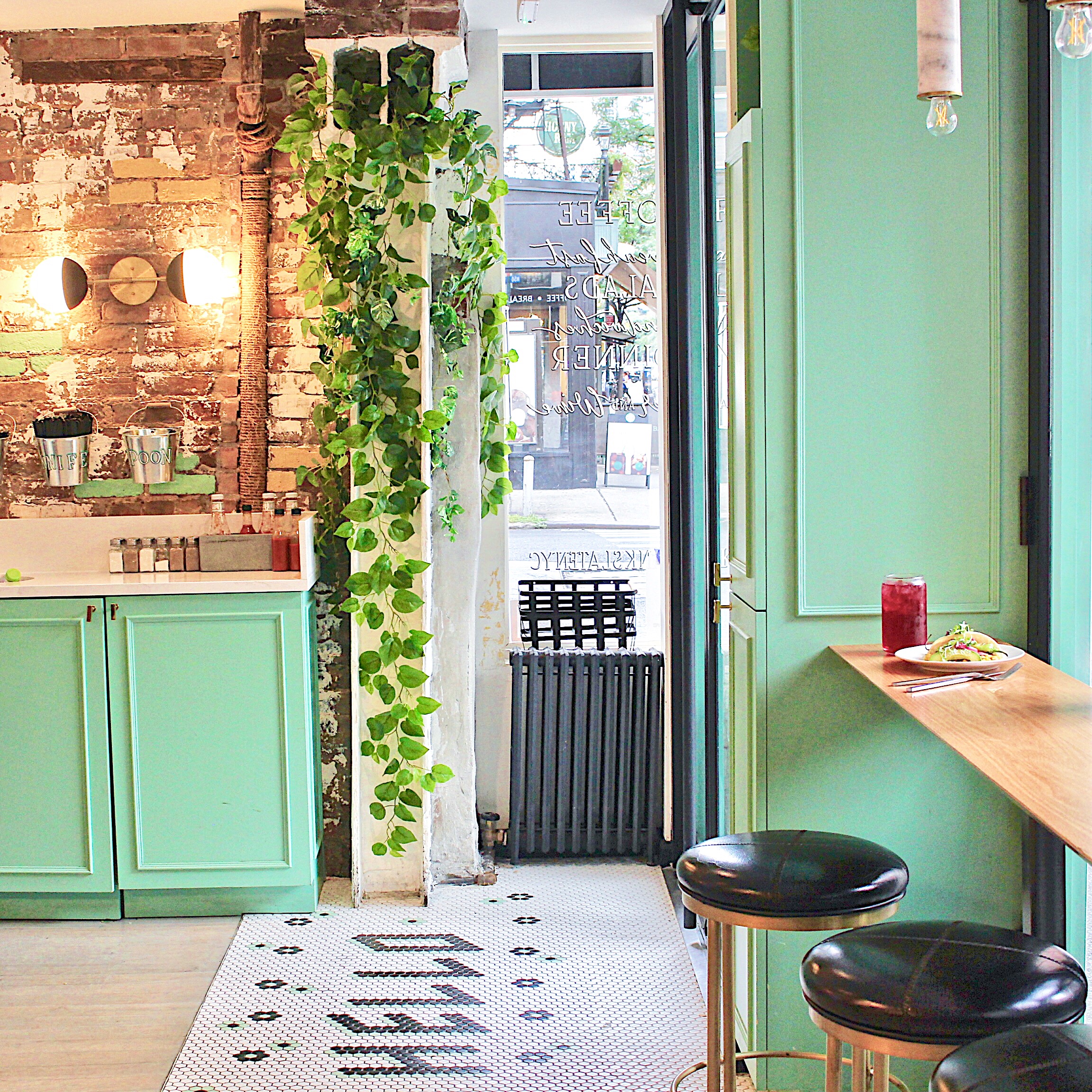 a dining room table in front of a window