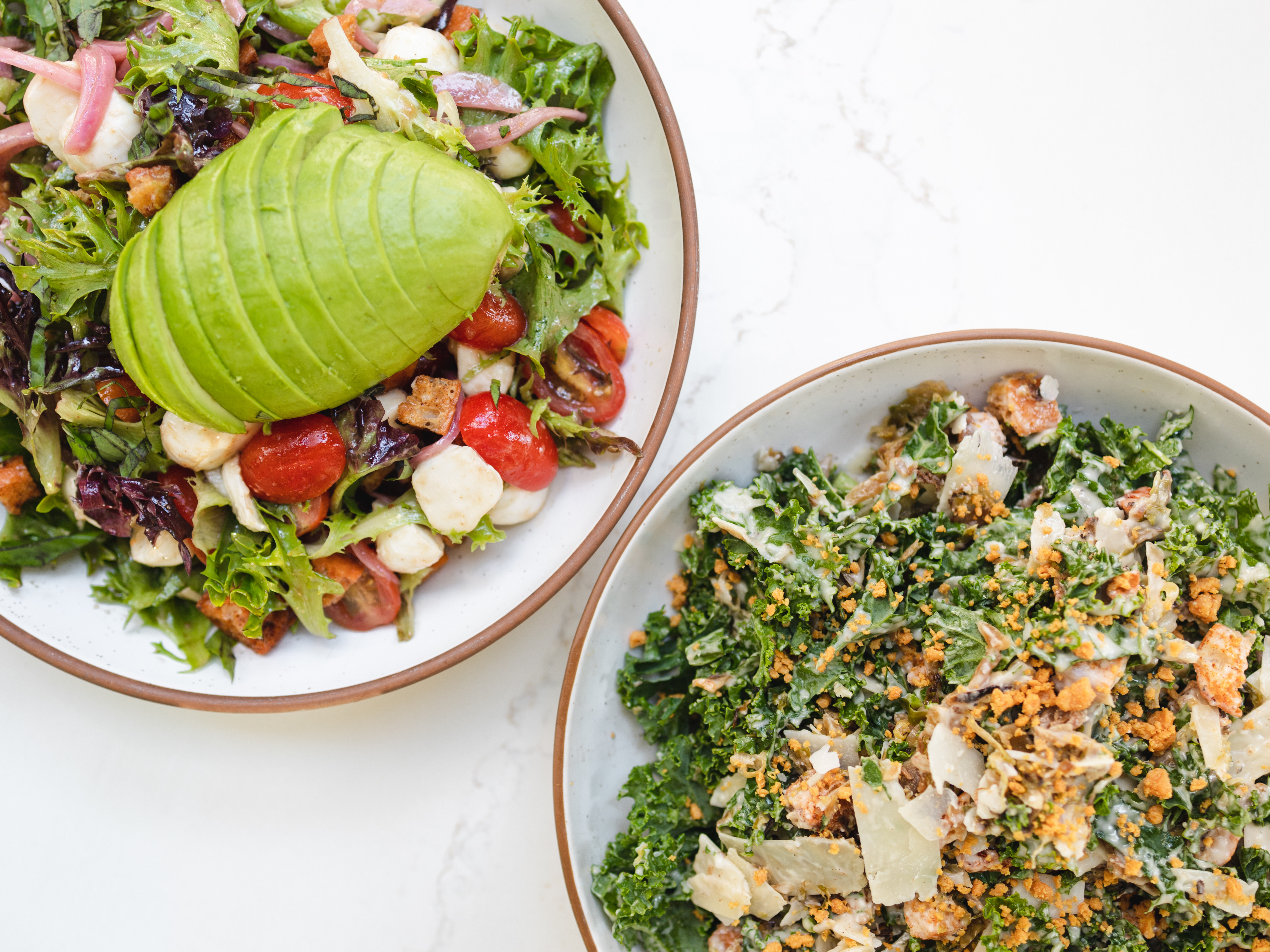 a bowl of salad on a plate