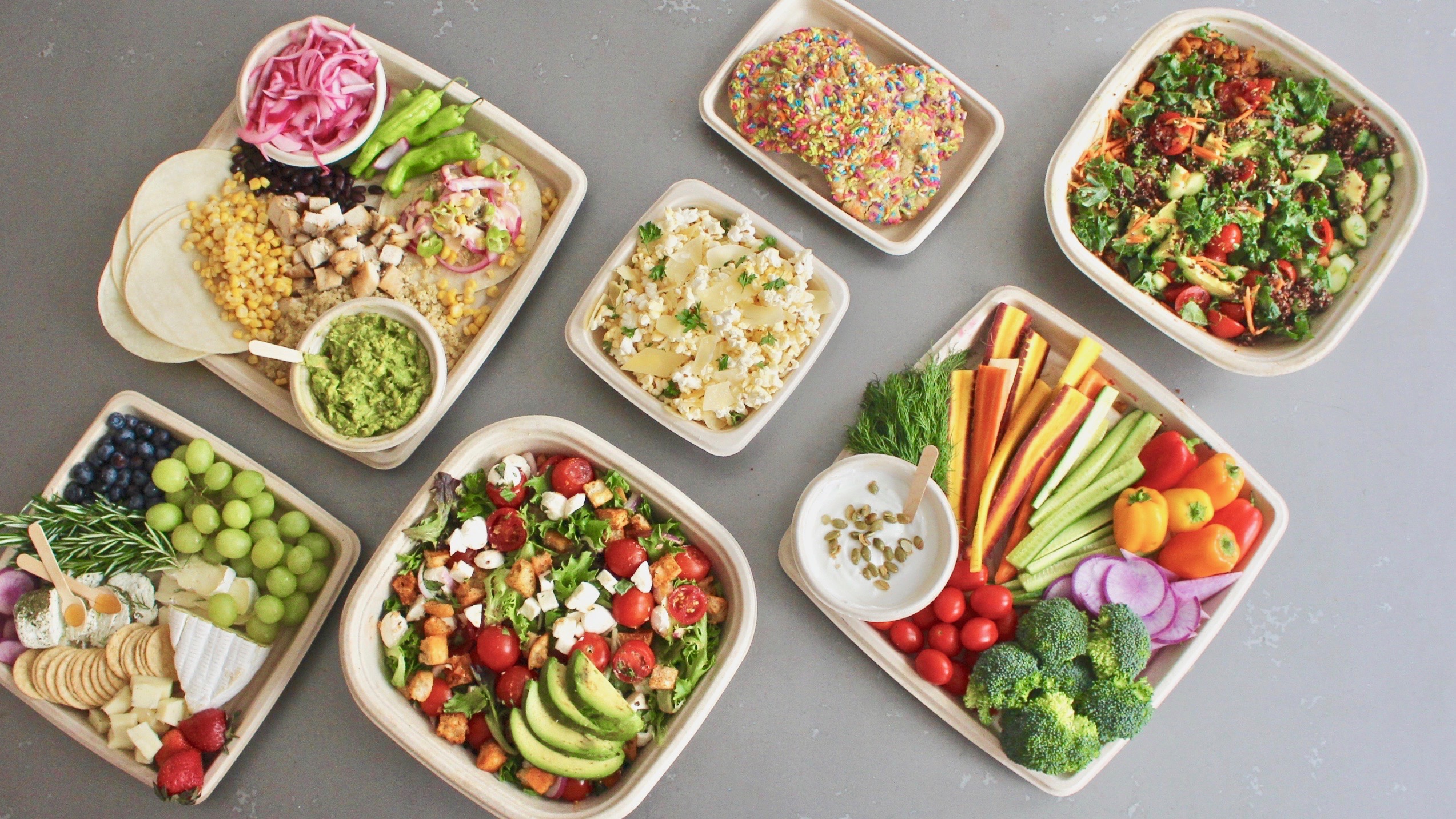 a box filled with different types of food on a plate