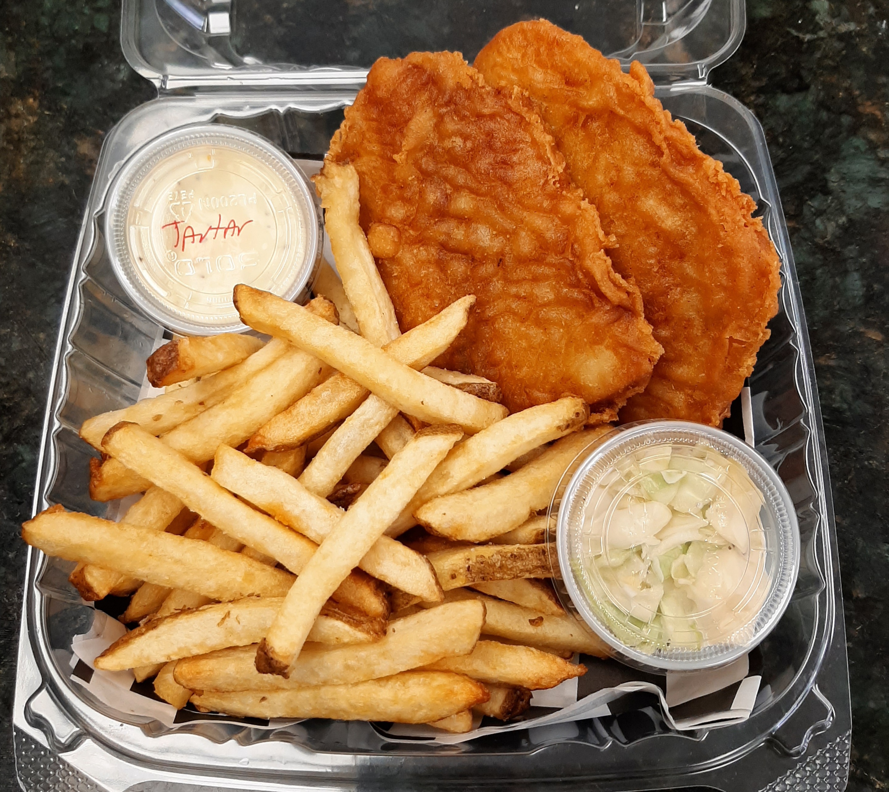 a tray of hot dogs and fries on a plate
