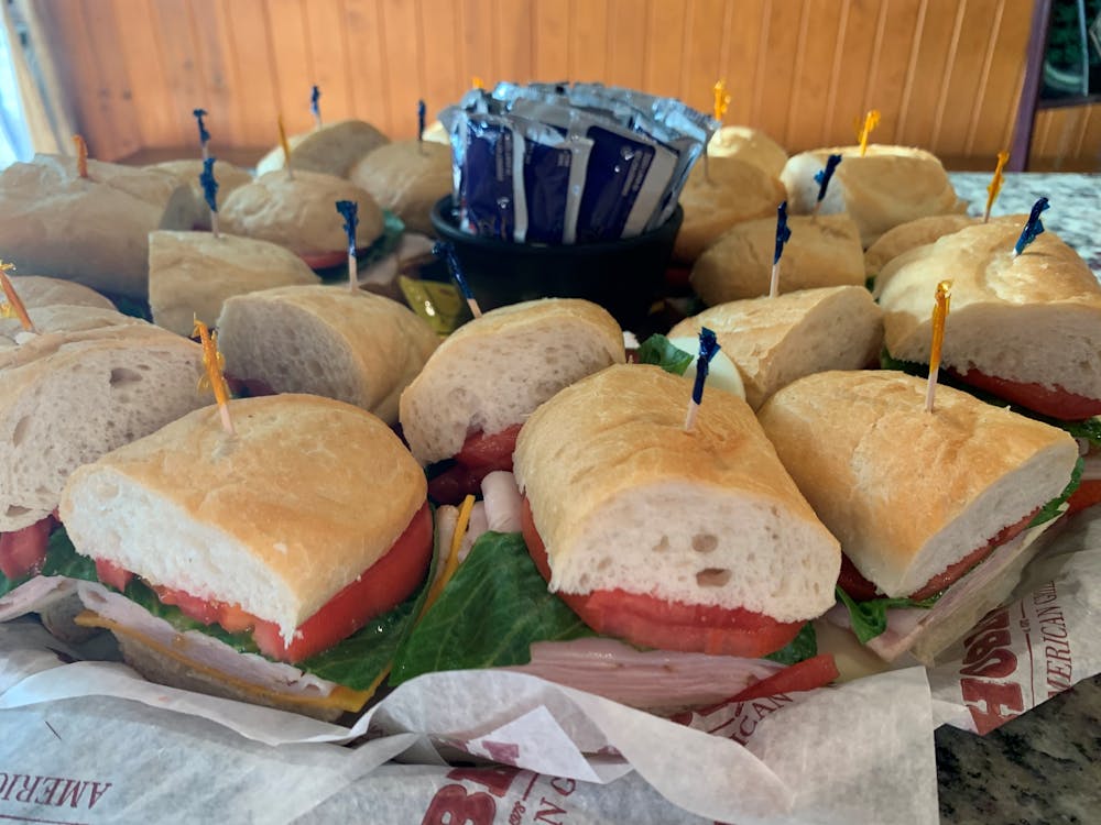 a cut in half sandwich sitting on top of a table