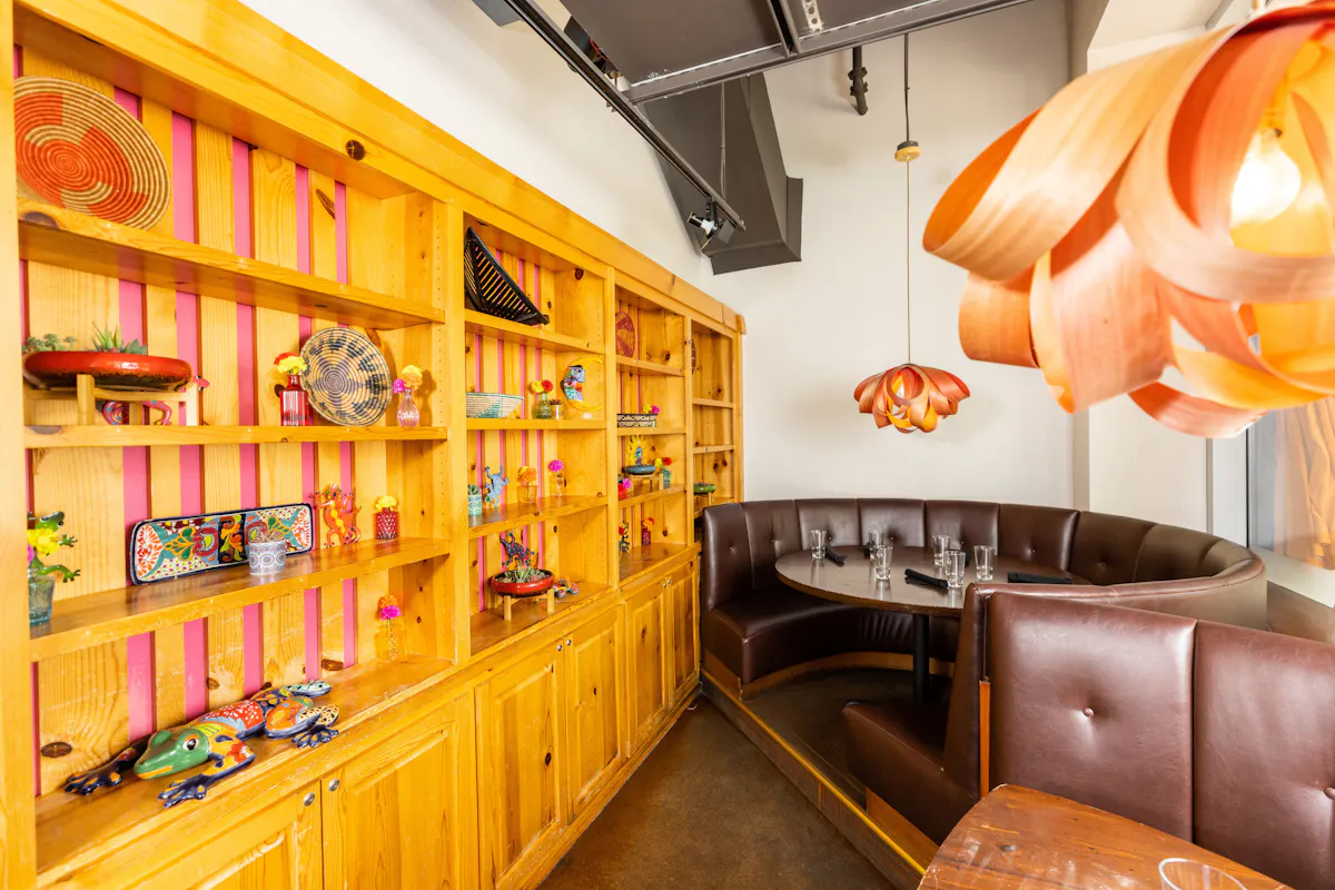 a room with a table and shelves