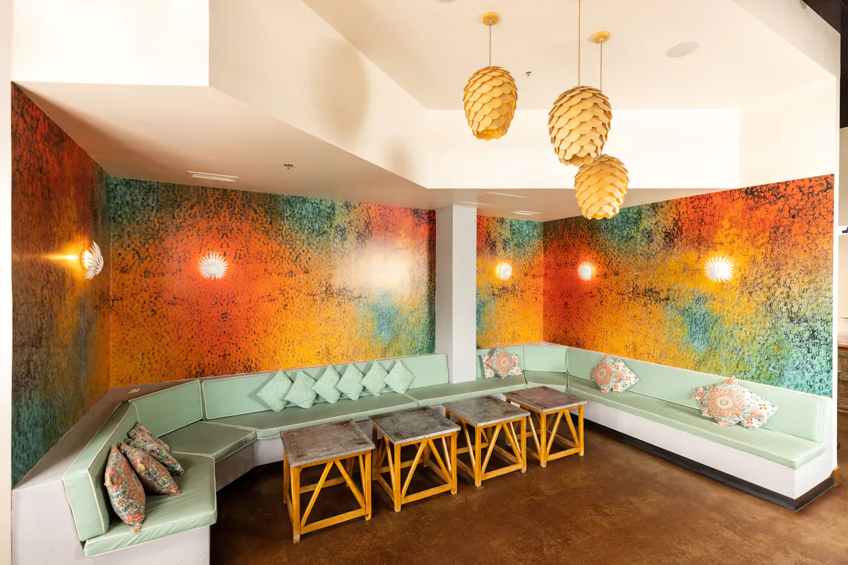 a room with a couch and tables