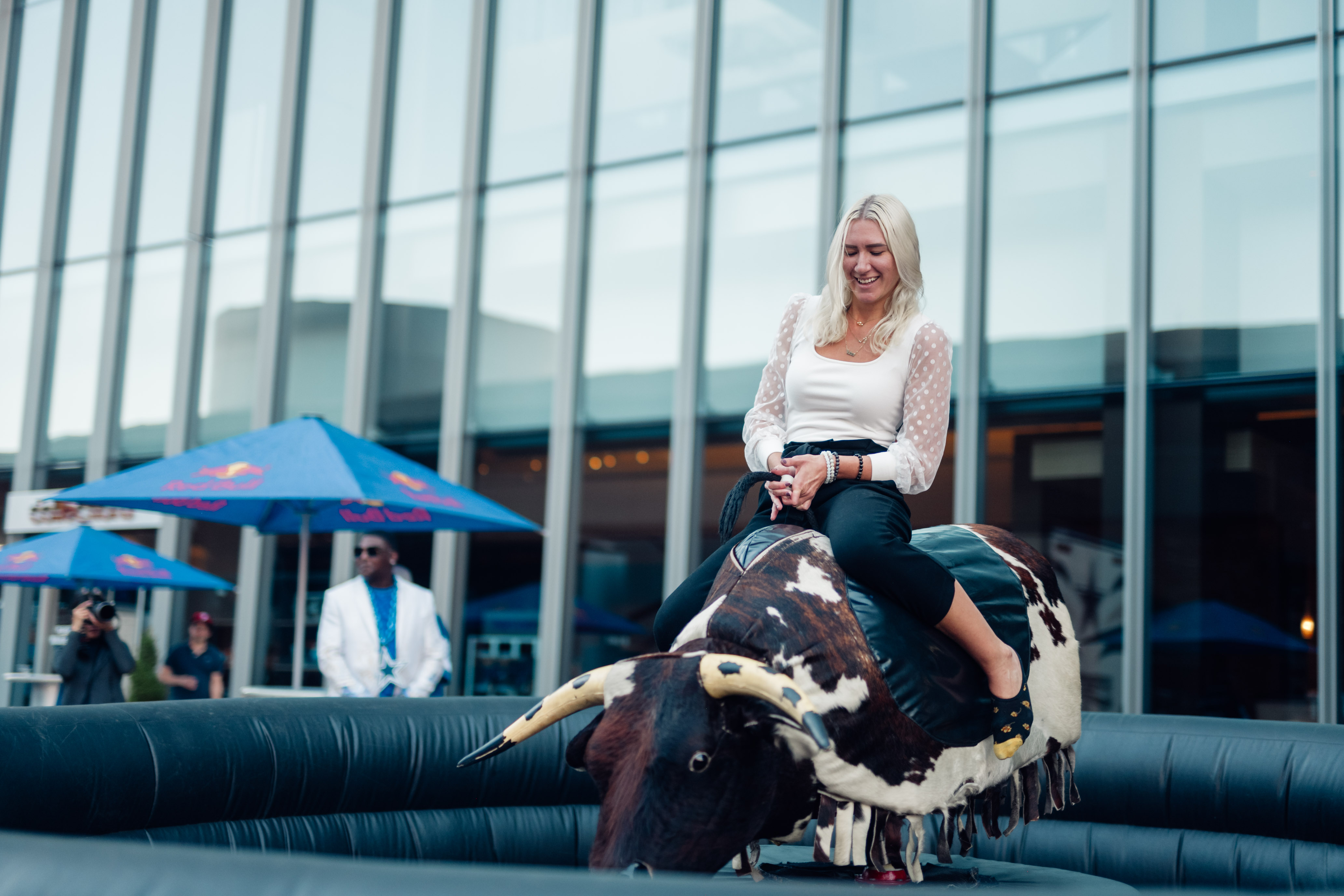 a woman riding a bull