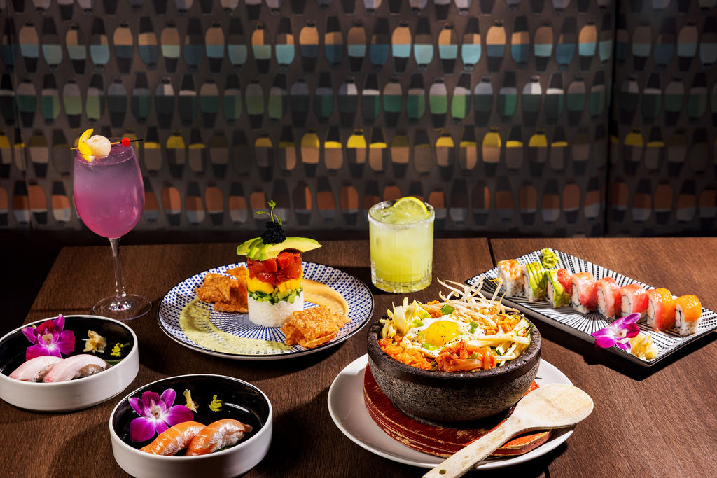 a table with plates of food and drinks
