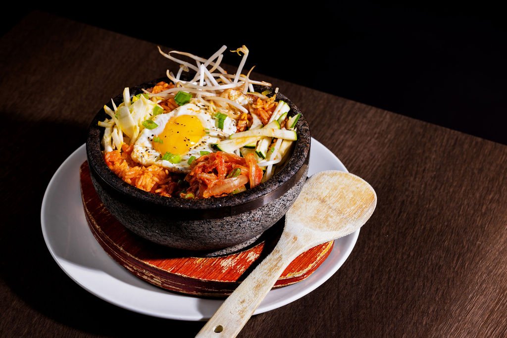 a bowl of food with a spoon
