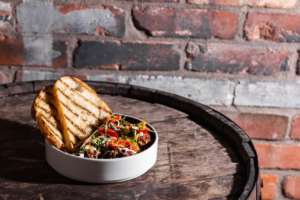 a bowl of food on a barrel