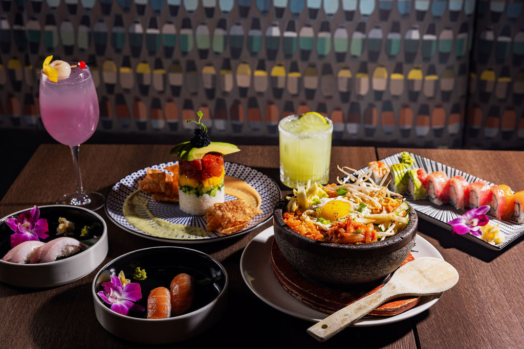 a table with plates of food and drinks