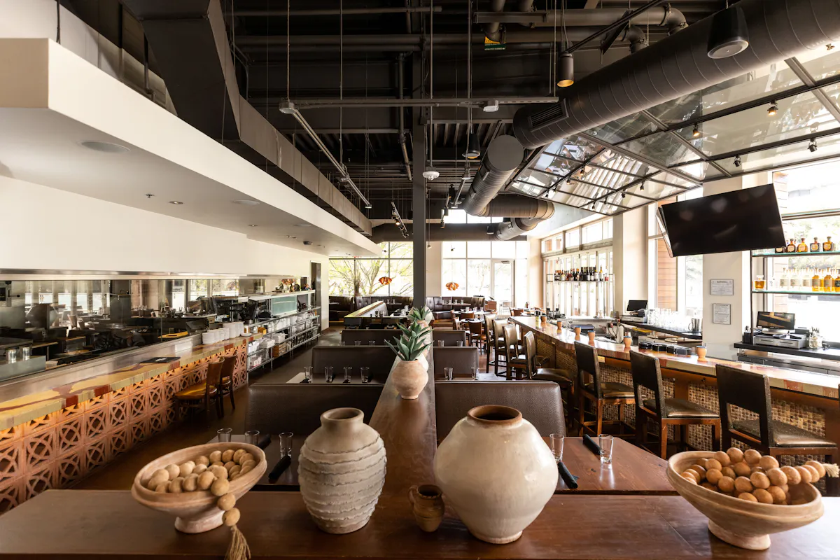 a restaurant with a large bar and a large tv