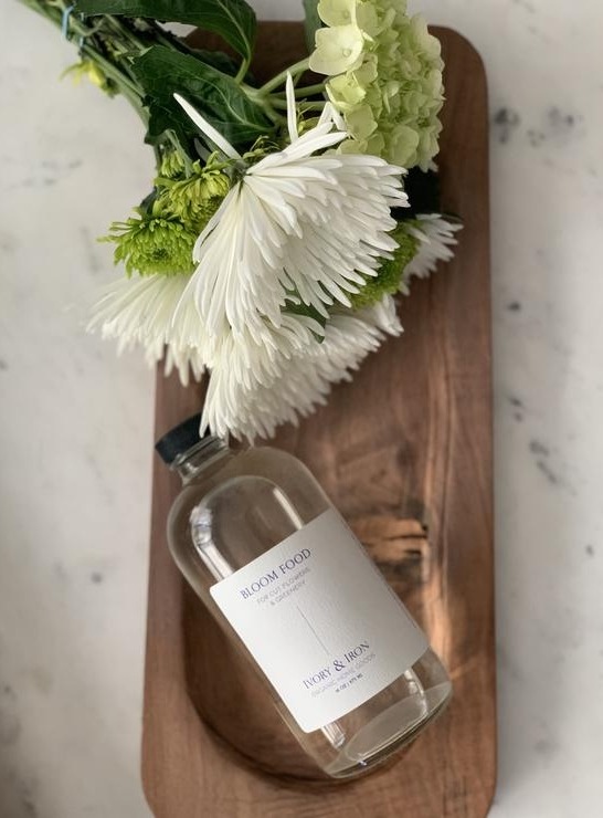 a vase of flowers sitting on a table