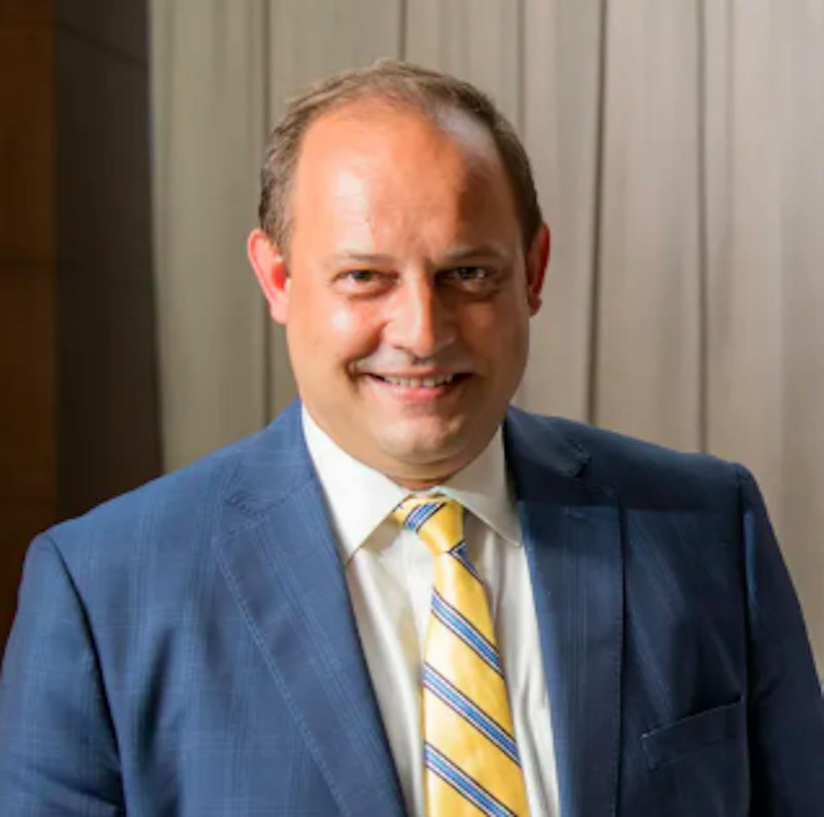 a man wearing a suit and tie
