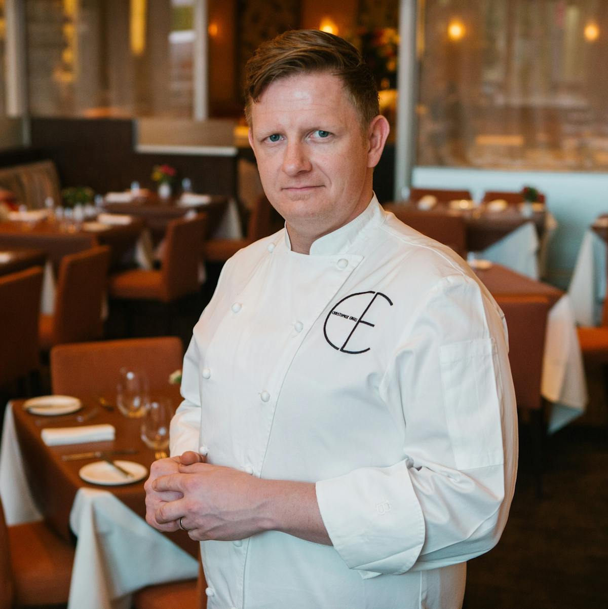 a man sitting at a table in a restaurant