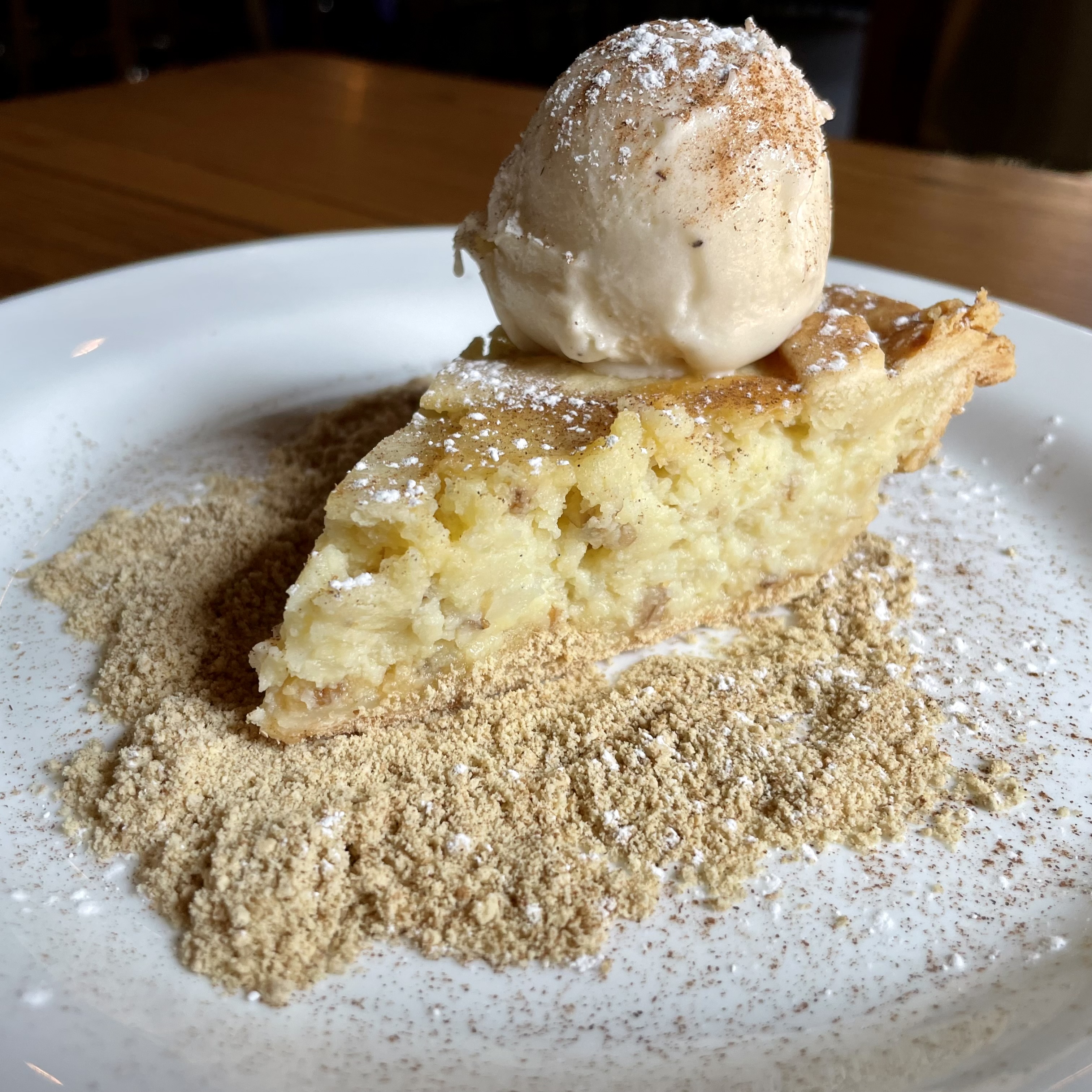 a half eaten piece of cake and ice cream on a plate