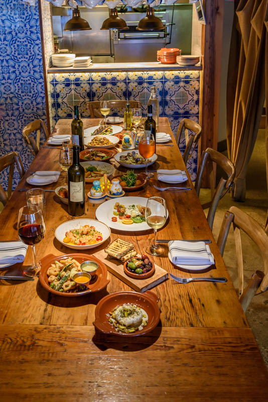 a dining room table with a plate of food