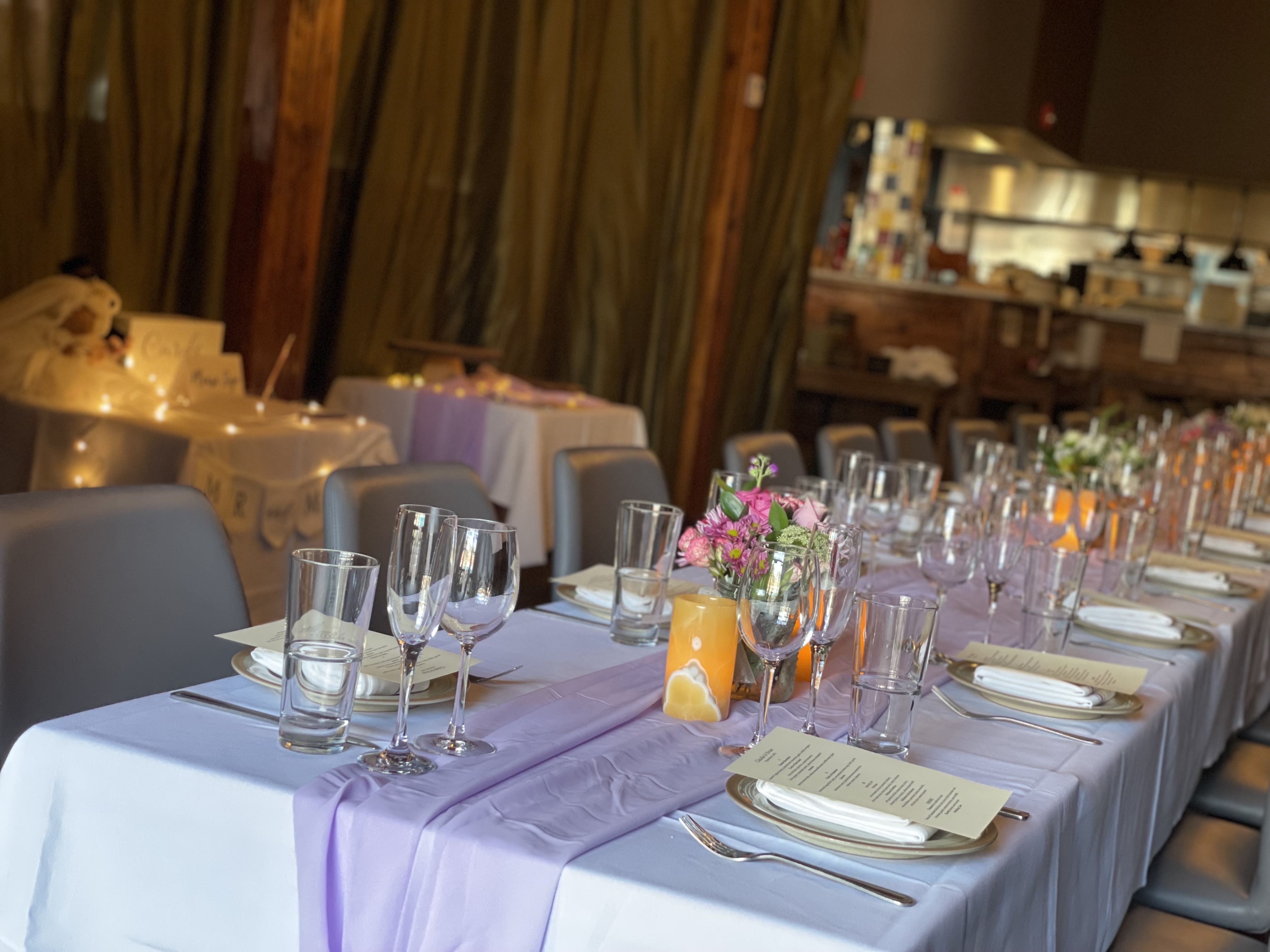 a group of people sitting at a table with wine glasses
