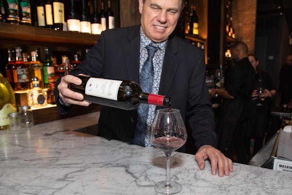 a person holding a glass of wine
