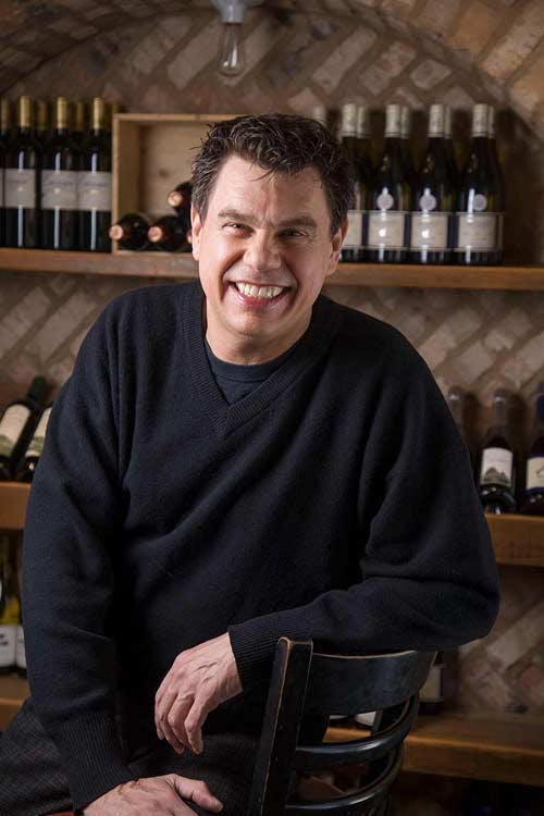 a man sitting at a table in a restaurant