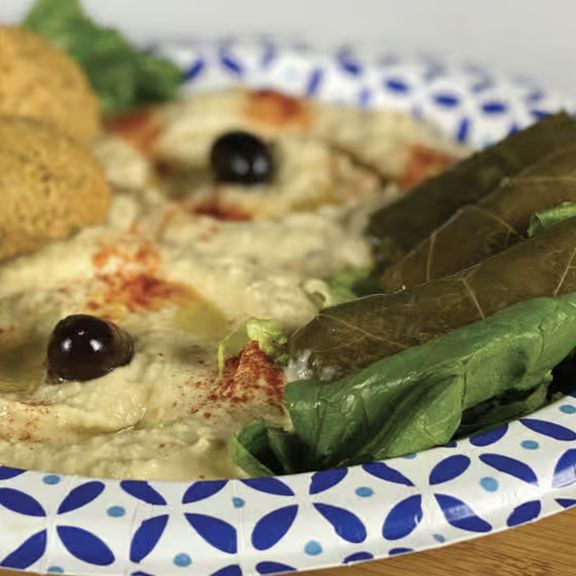 a plate of food with a slice of pizza