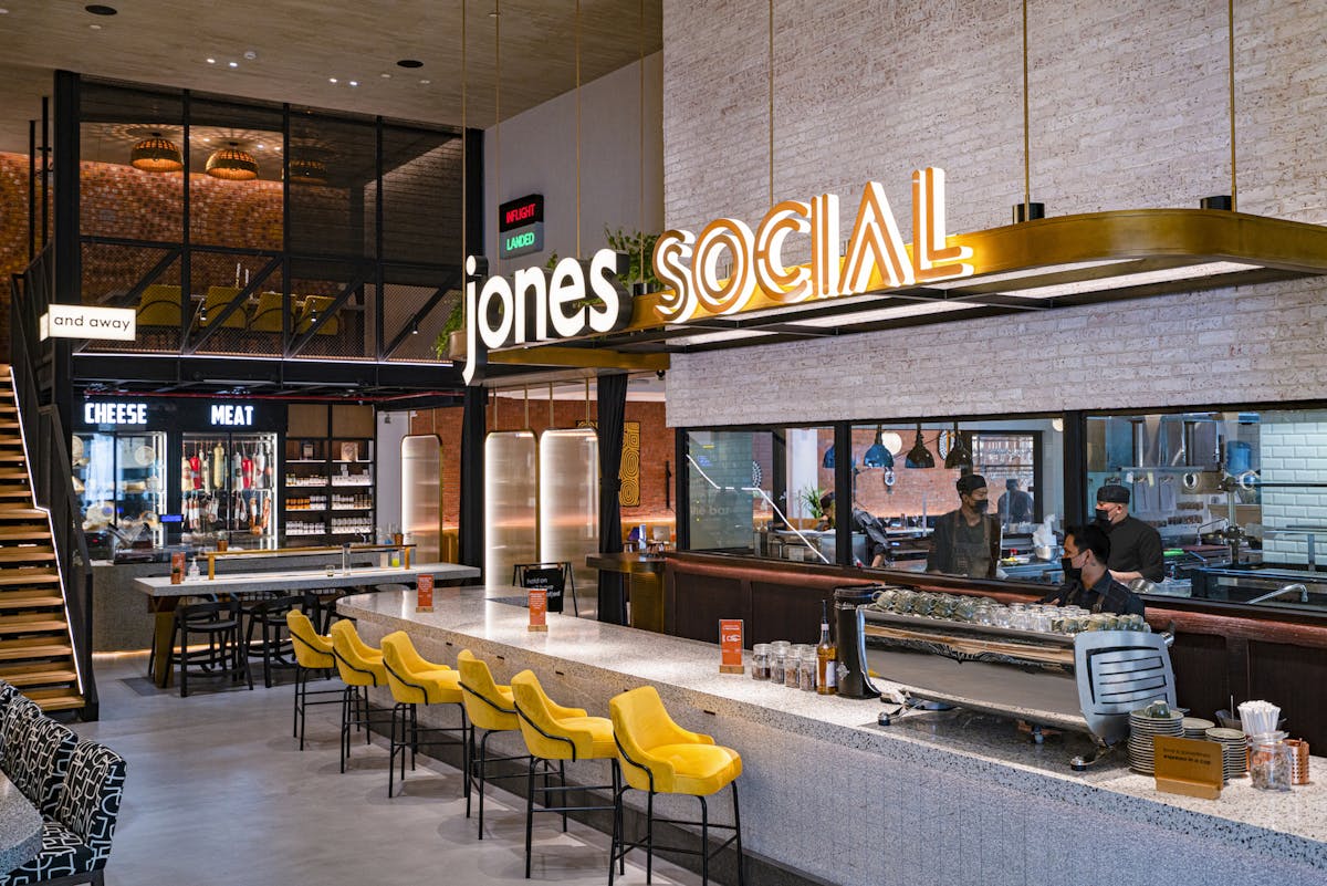a group of people sitting at a table in a restaurant