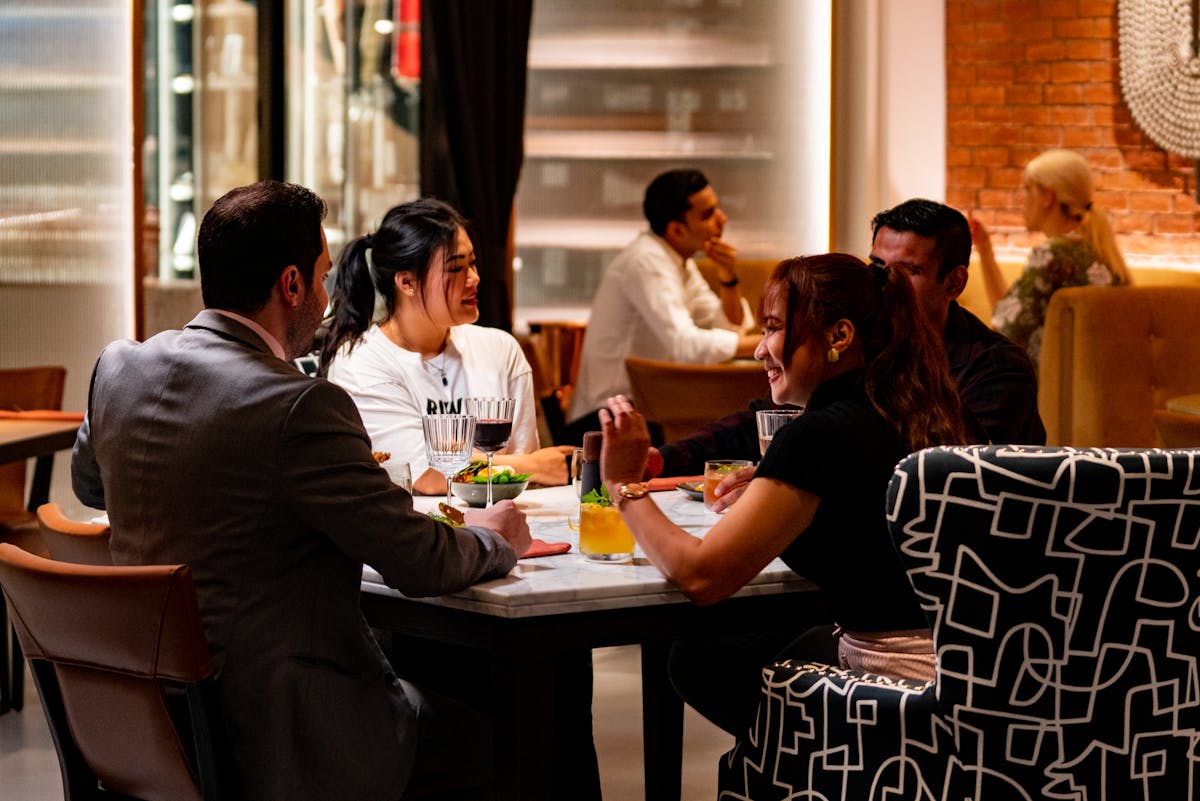 a group of people sitting at a table