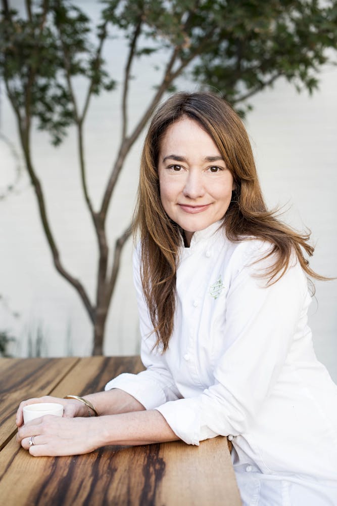 a person sitting on a bench posing for the camera