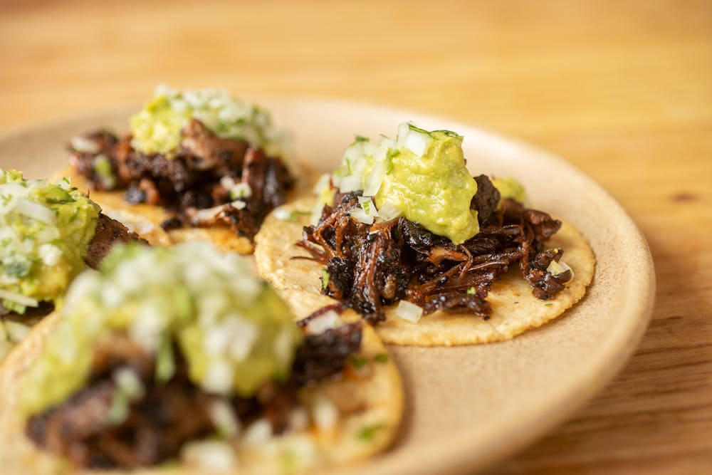 a plate of food on a wooden table