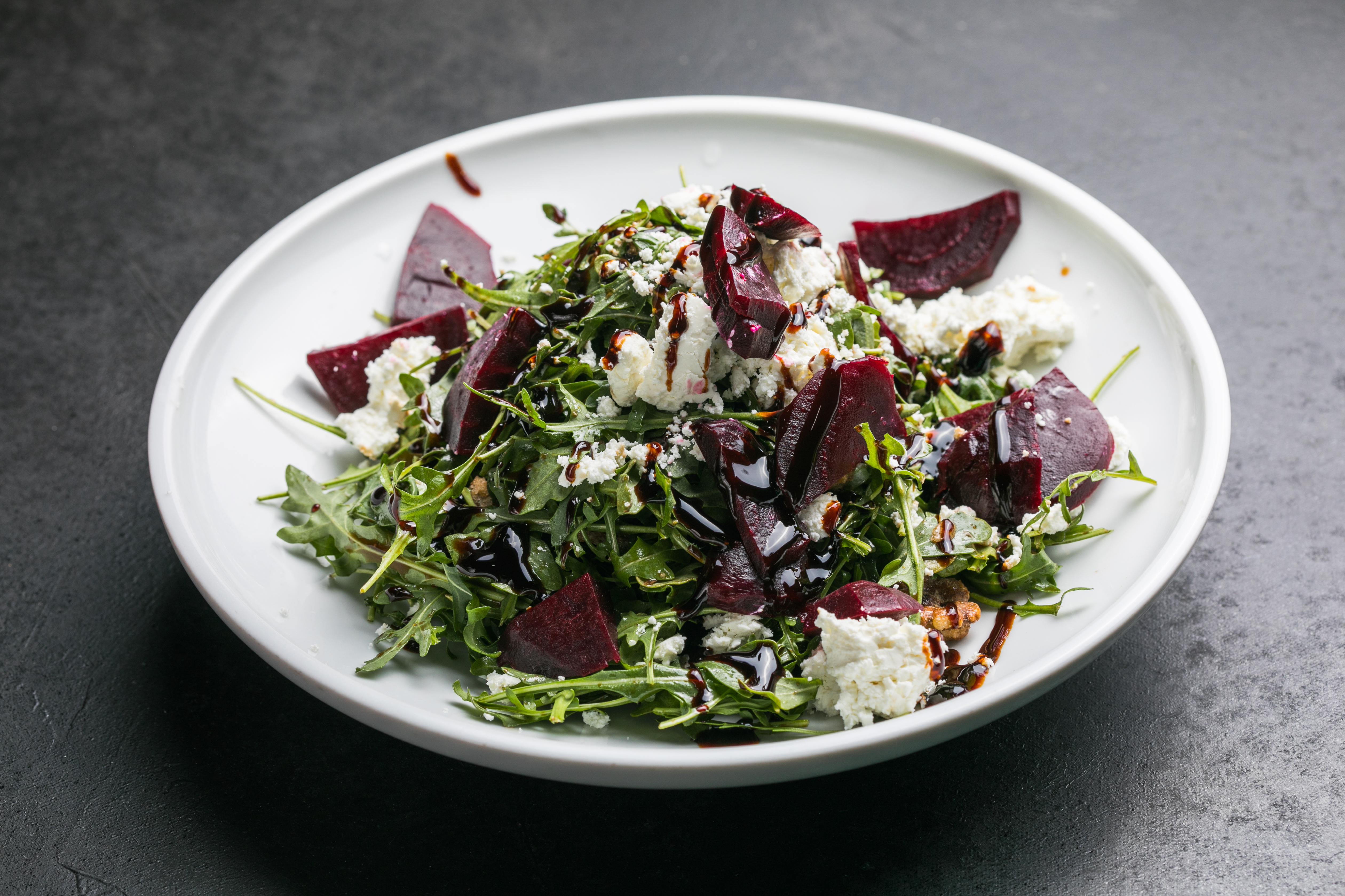a bowl of salad on a plate