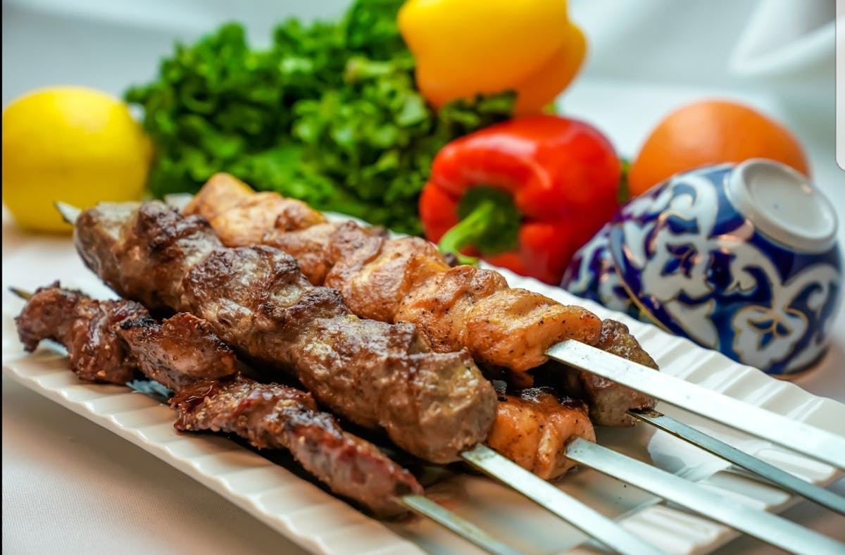 a plate of food with meat and vegetables