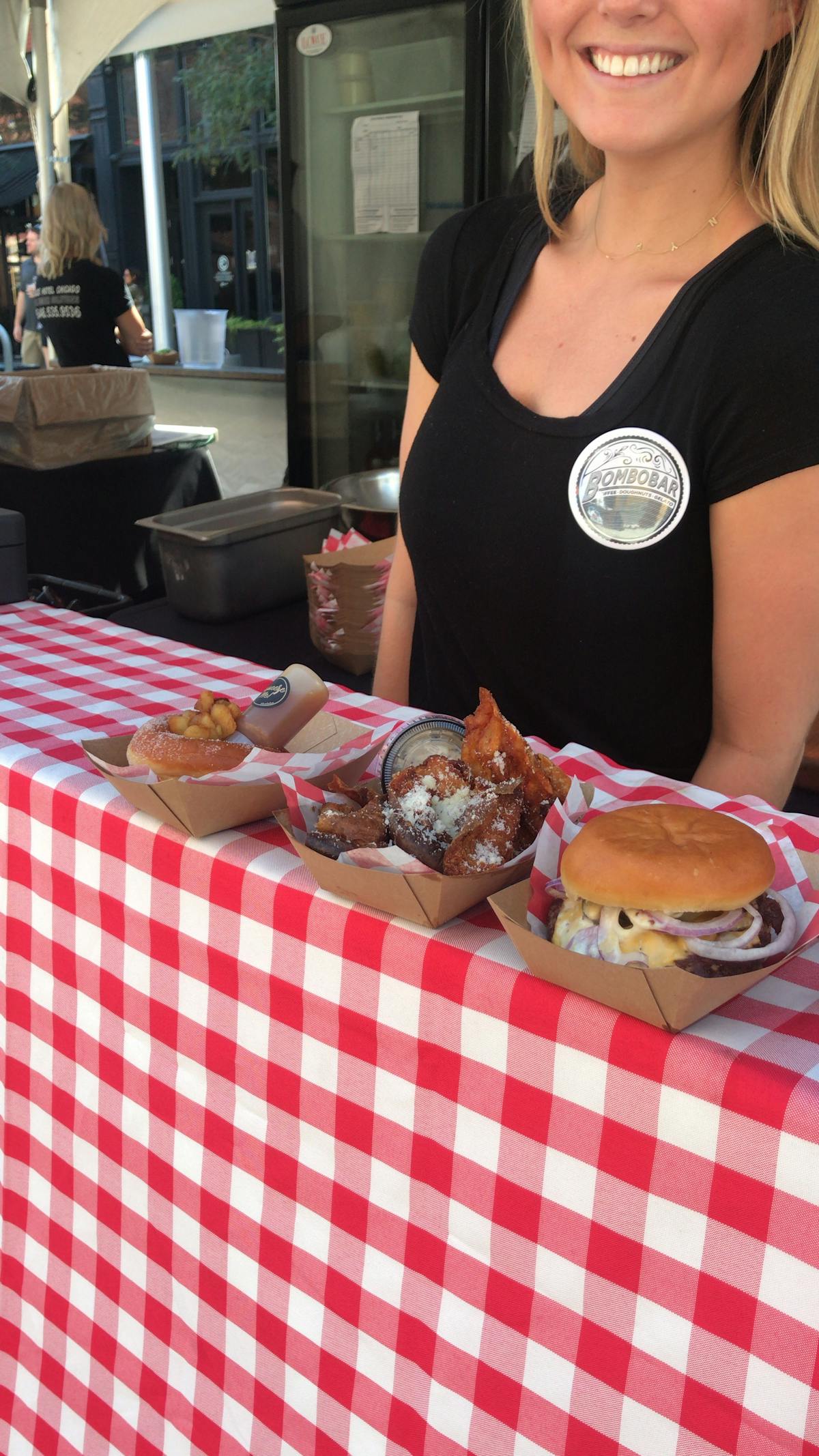 a woman sitting at a table with food