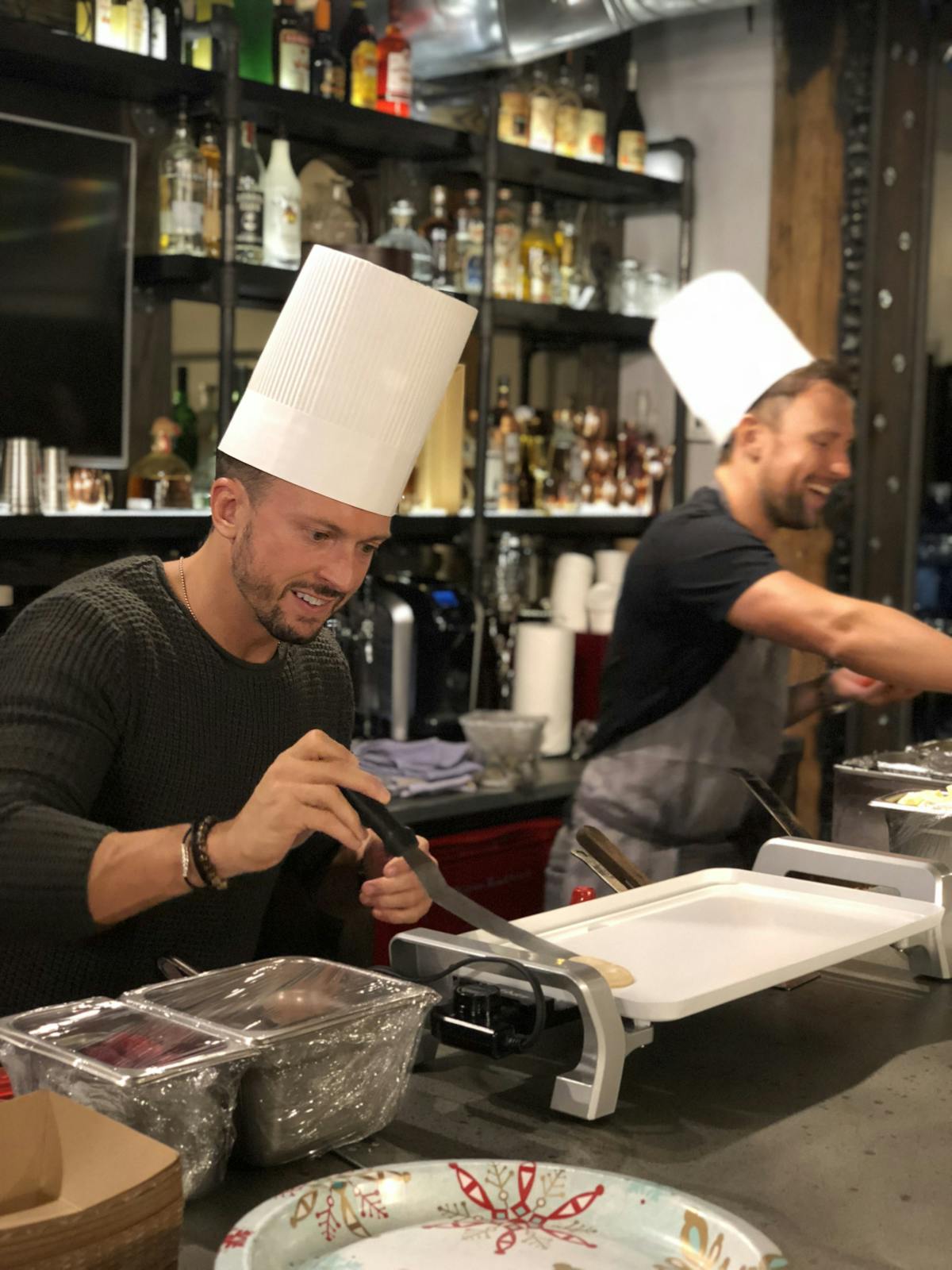 a person cooking in a kitchen preparing food