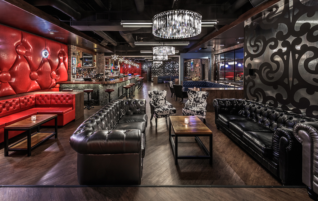 a room with two blue dining booths