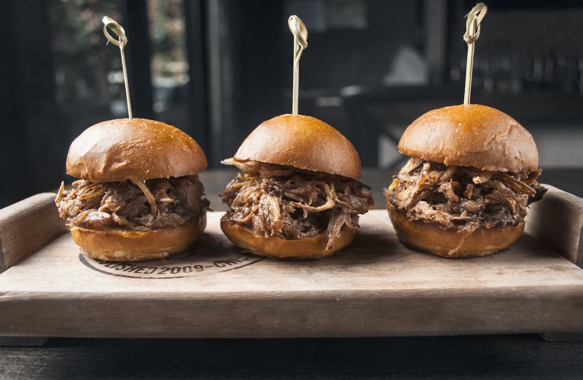a sandwich sitting on top of a wooden table
