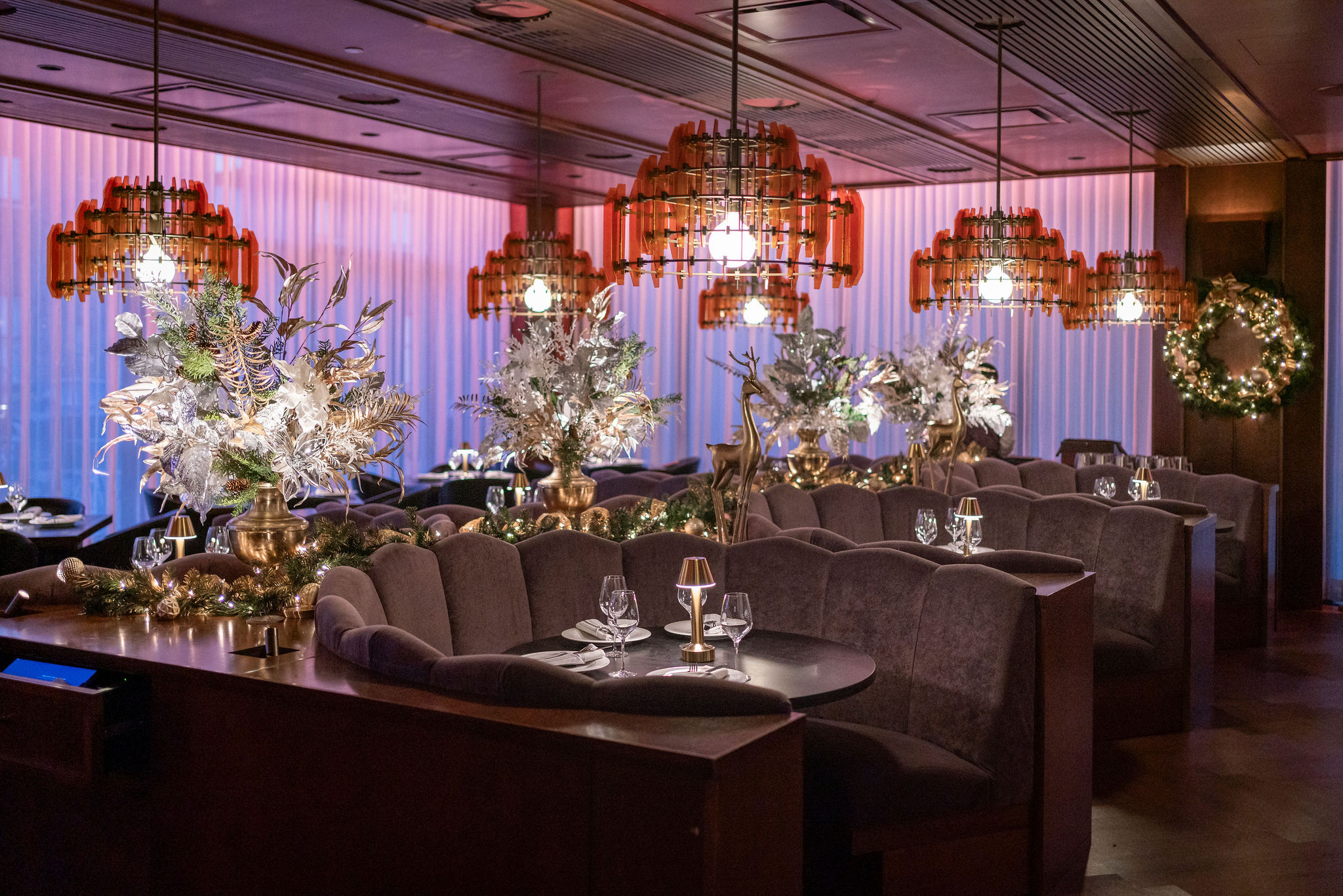 a room filled with furniture and vase of flowers on a table