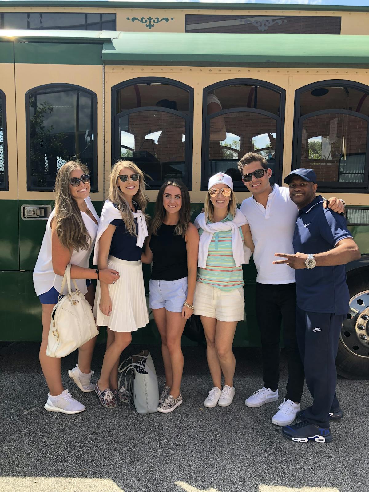 Chandra Knudsen et al. standing in front of a bus