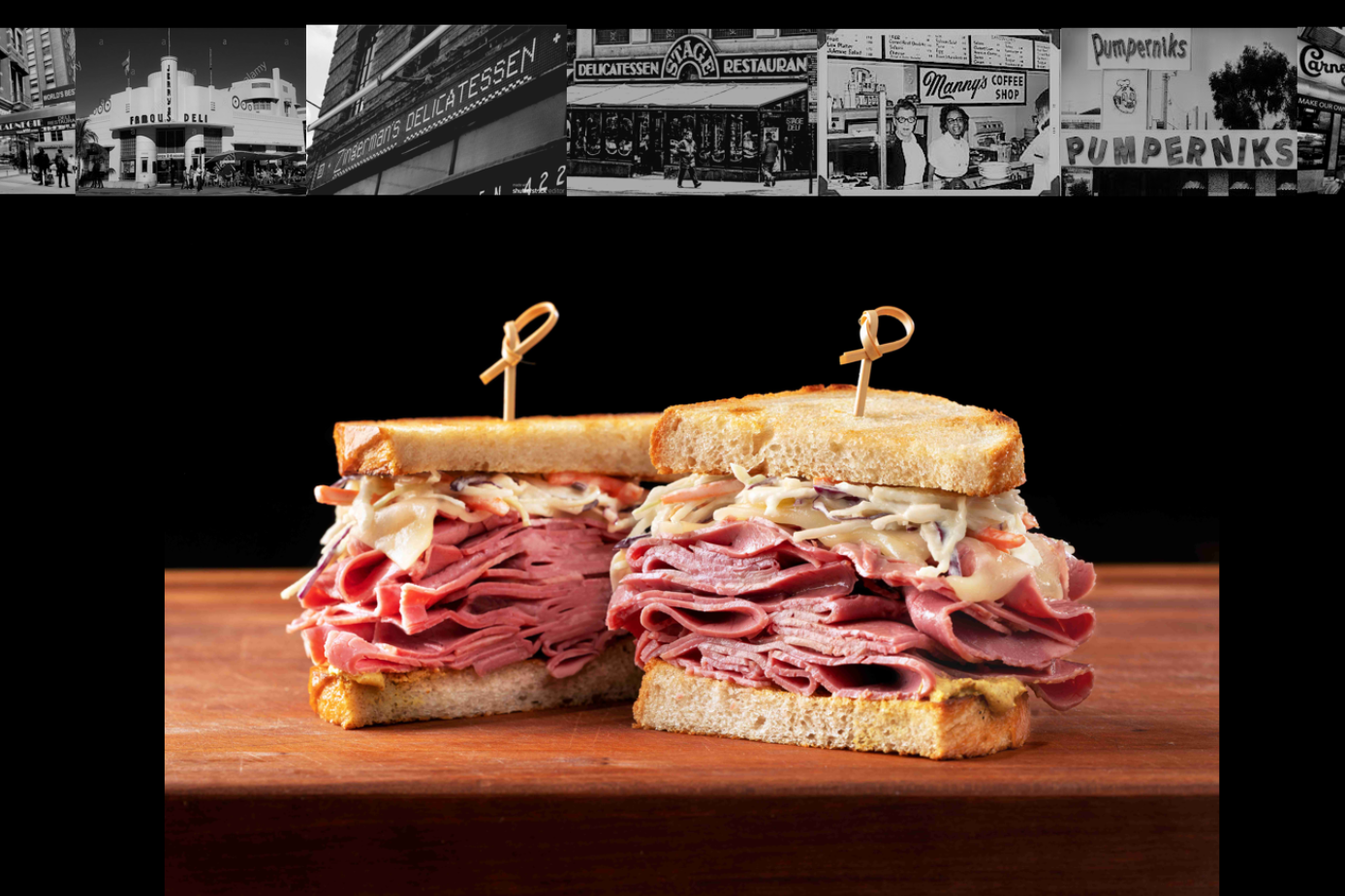 a sandwich sitting on top of a cutting board with a cake