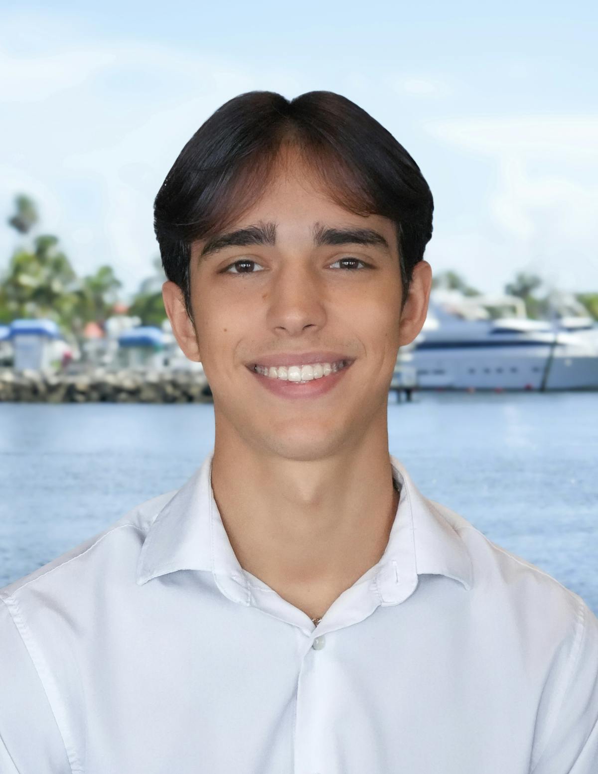 a person smiling next to a body of water