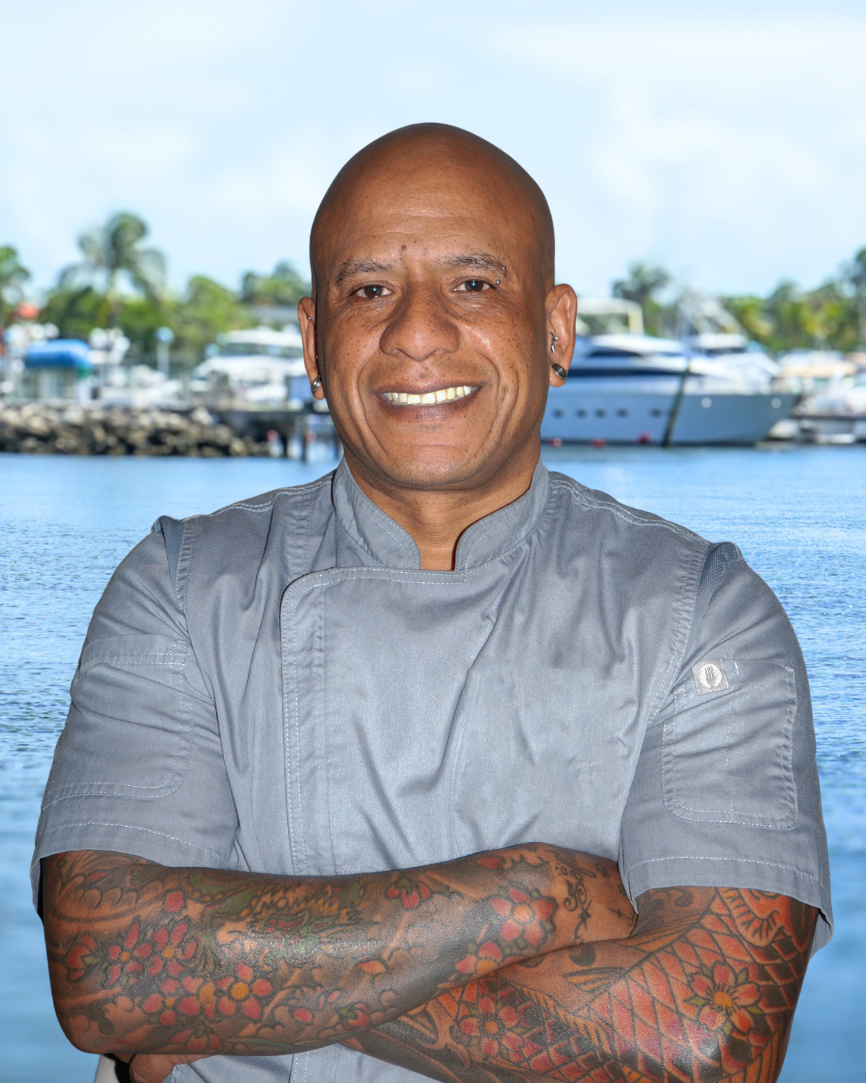 a man holding a fish in the water